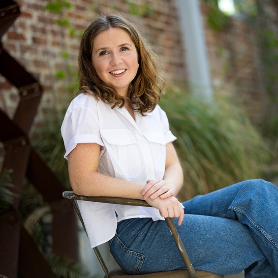 Lady sitting on chair 