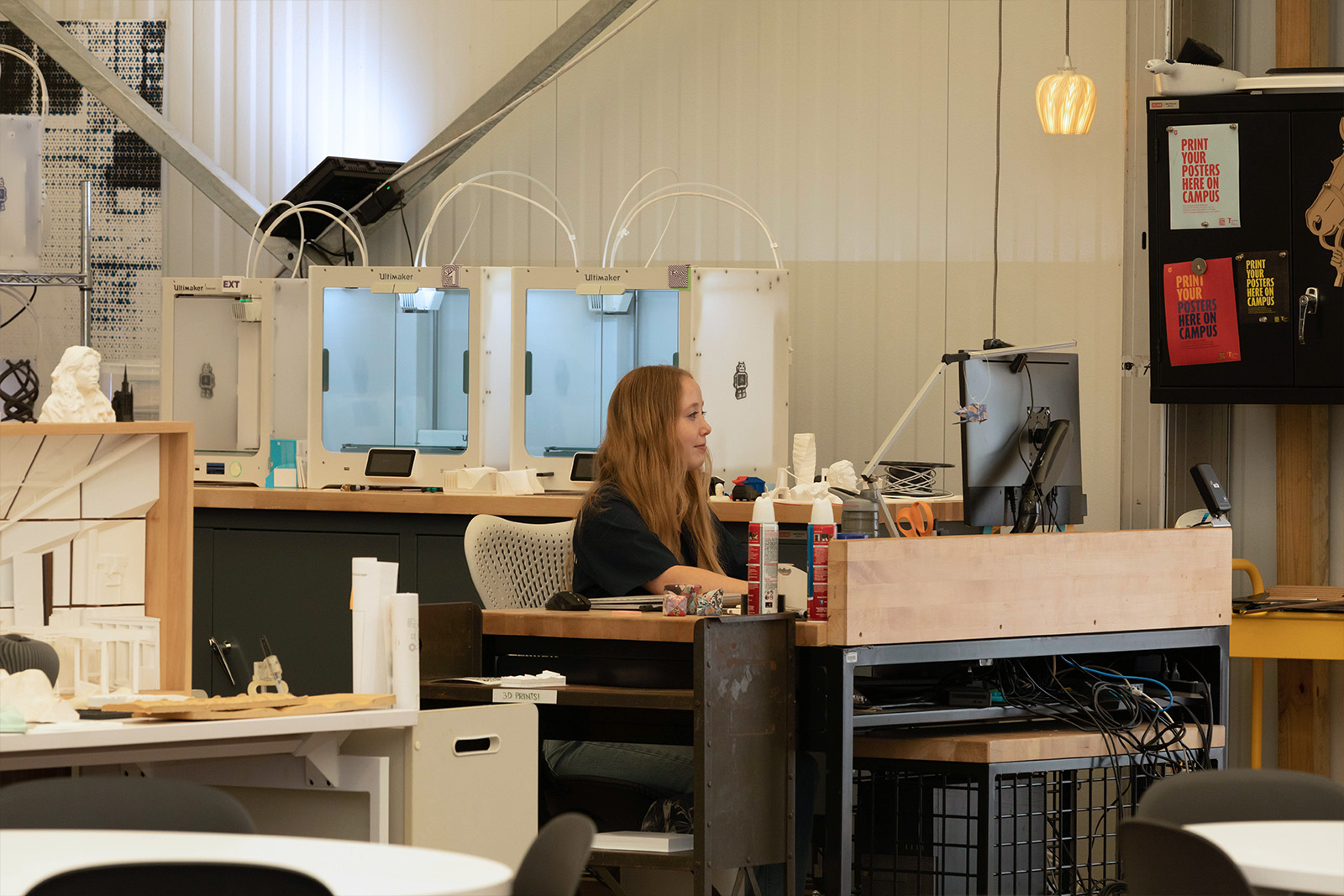 Student worker, Sarie, working at the Print Lab in NQ1