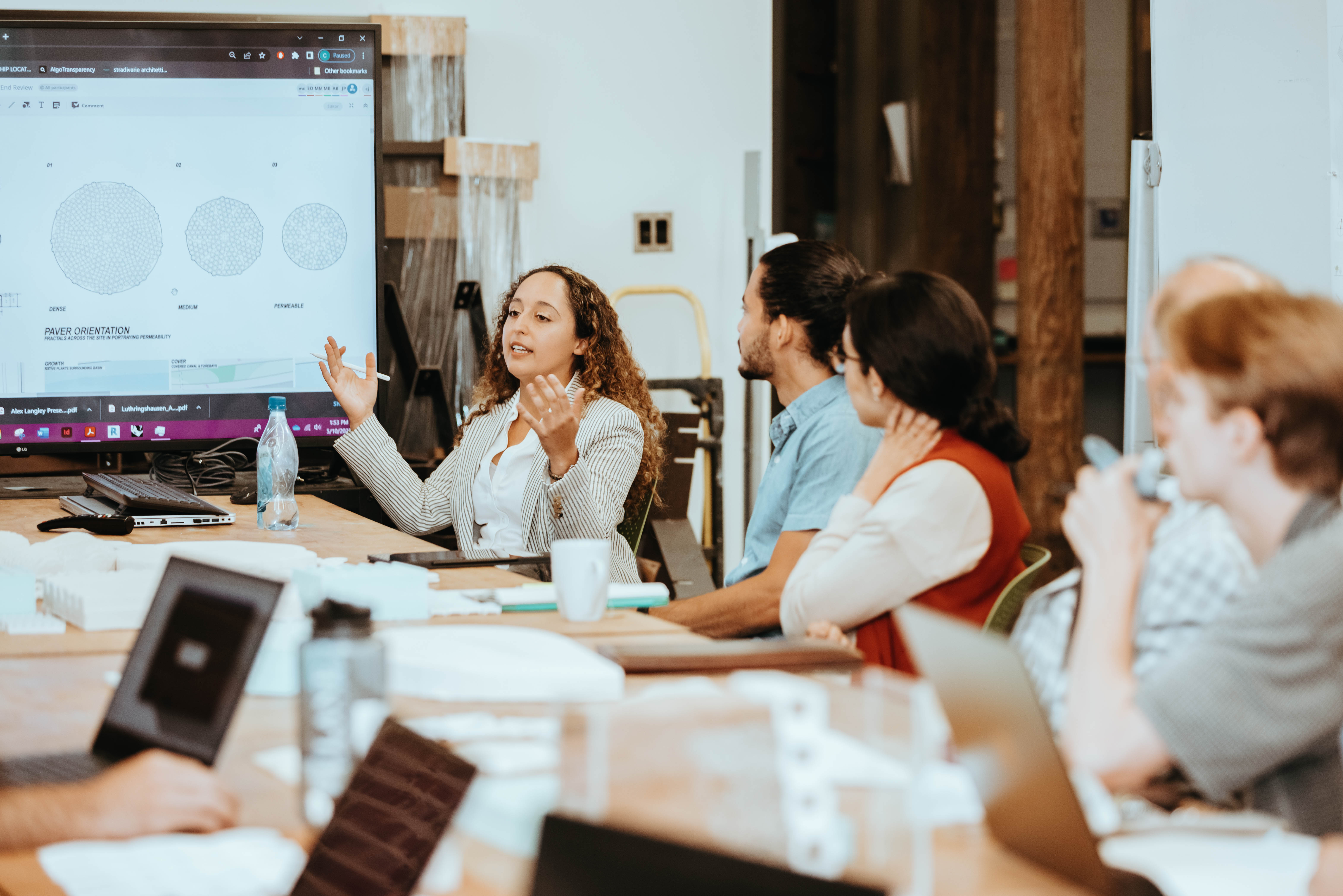 Individuals speaking in a meeting