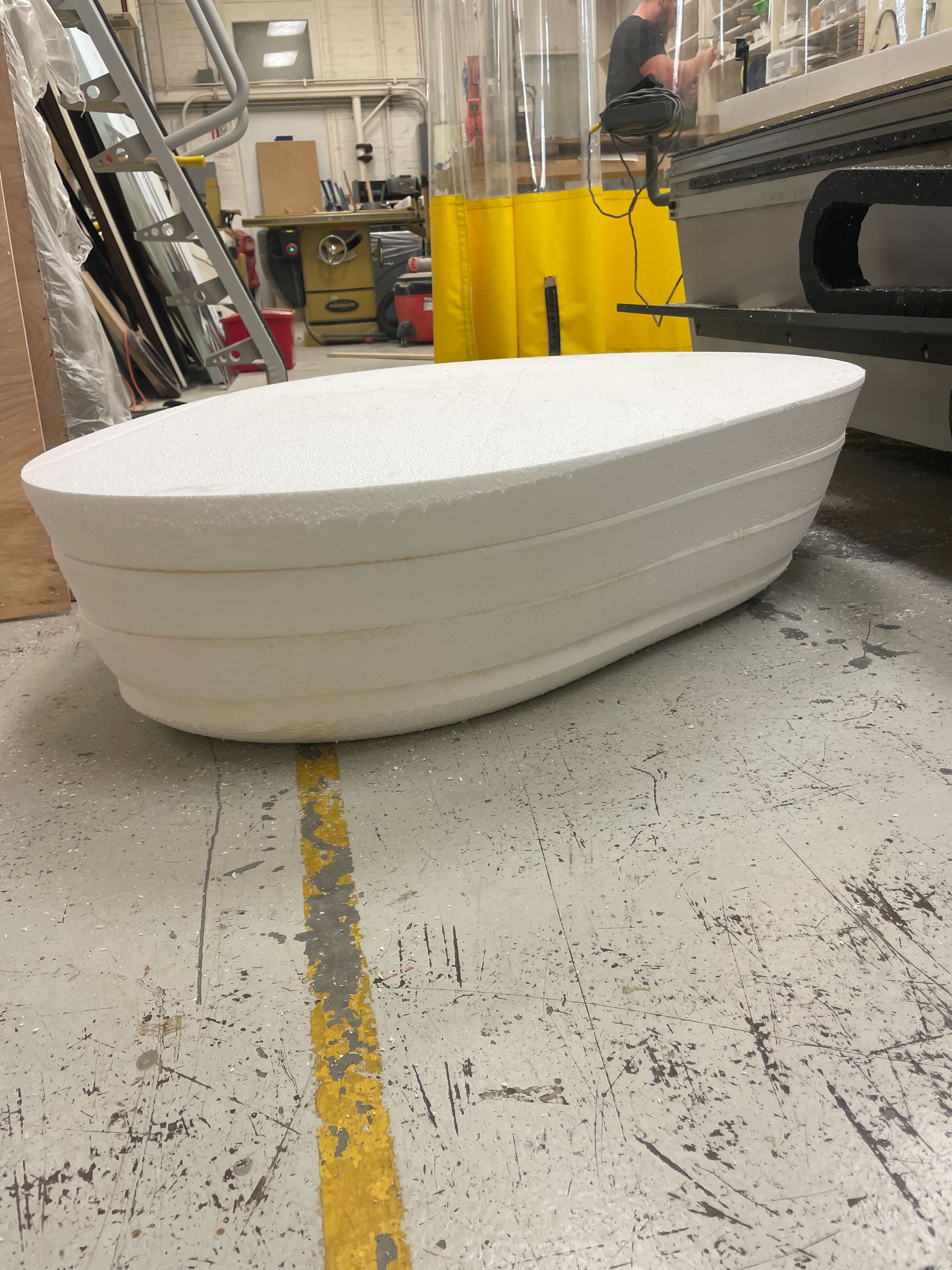 Model of a blob-shaped bench inside a workshop