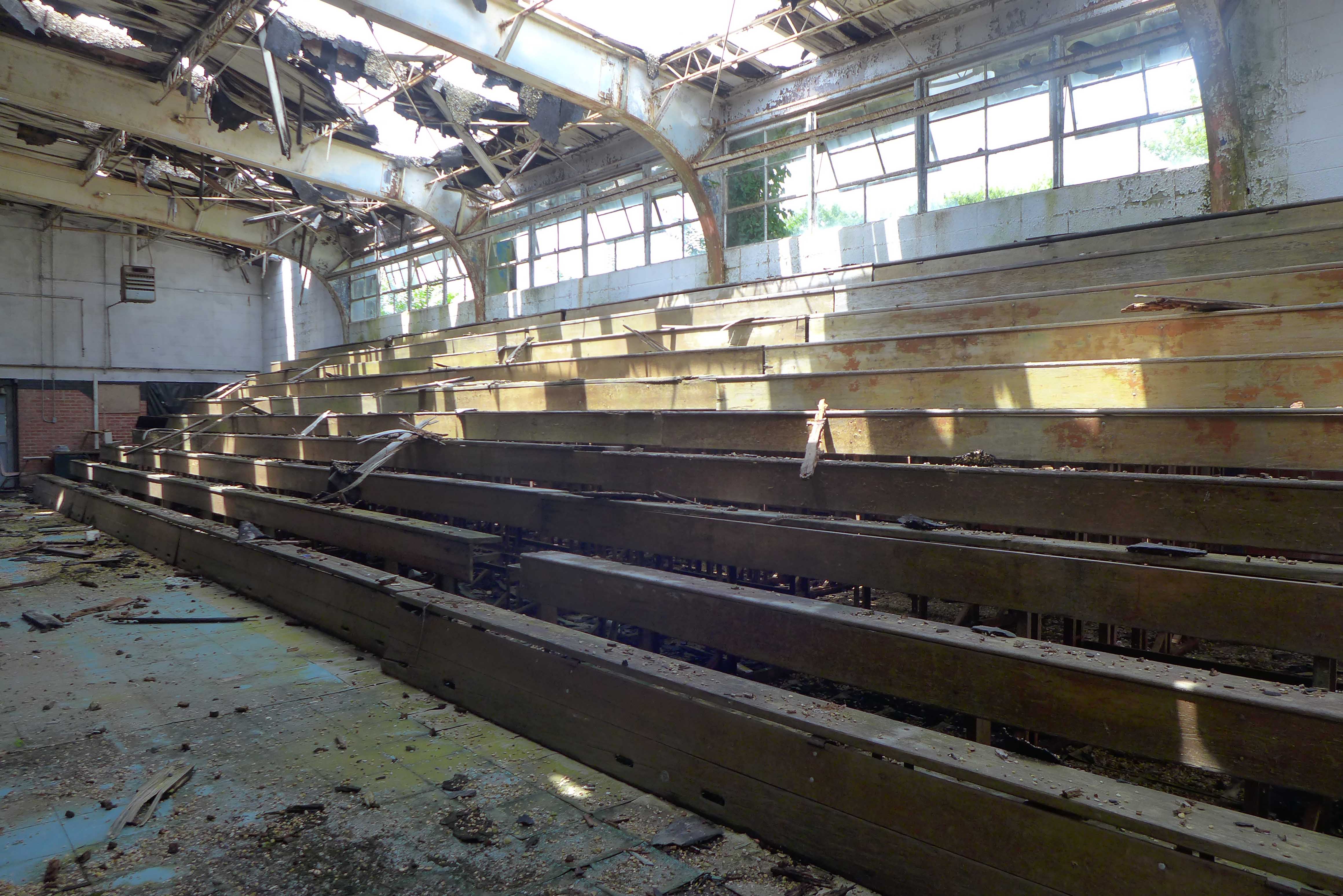 Photo of broken down bleachers in school gym