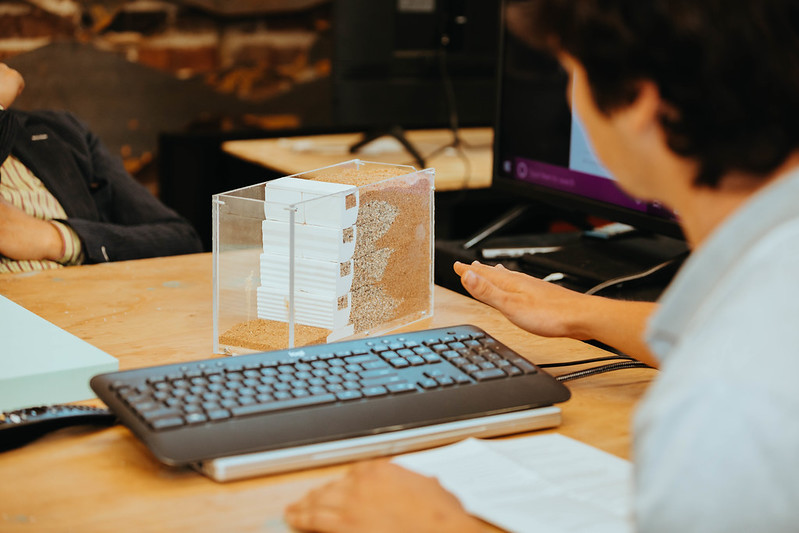 Student working with a keyboard and built project