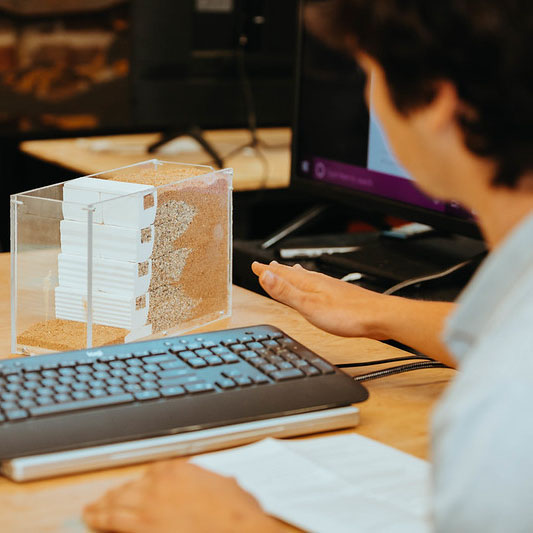 Student working with a keyboard and built project