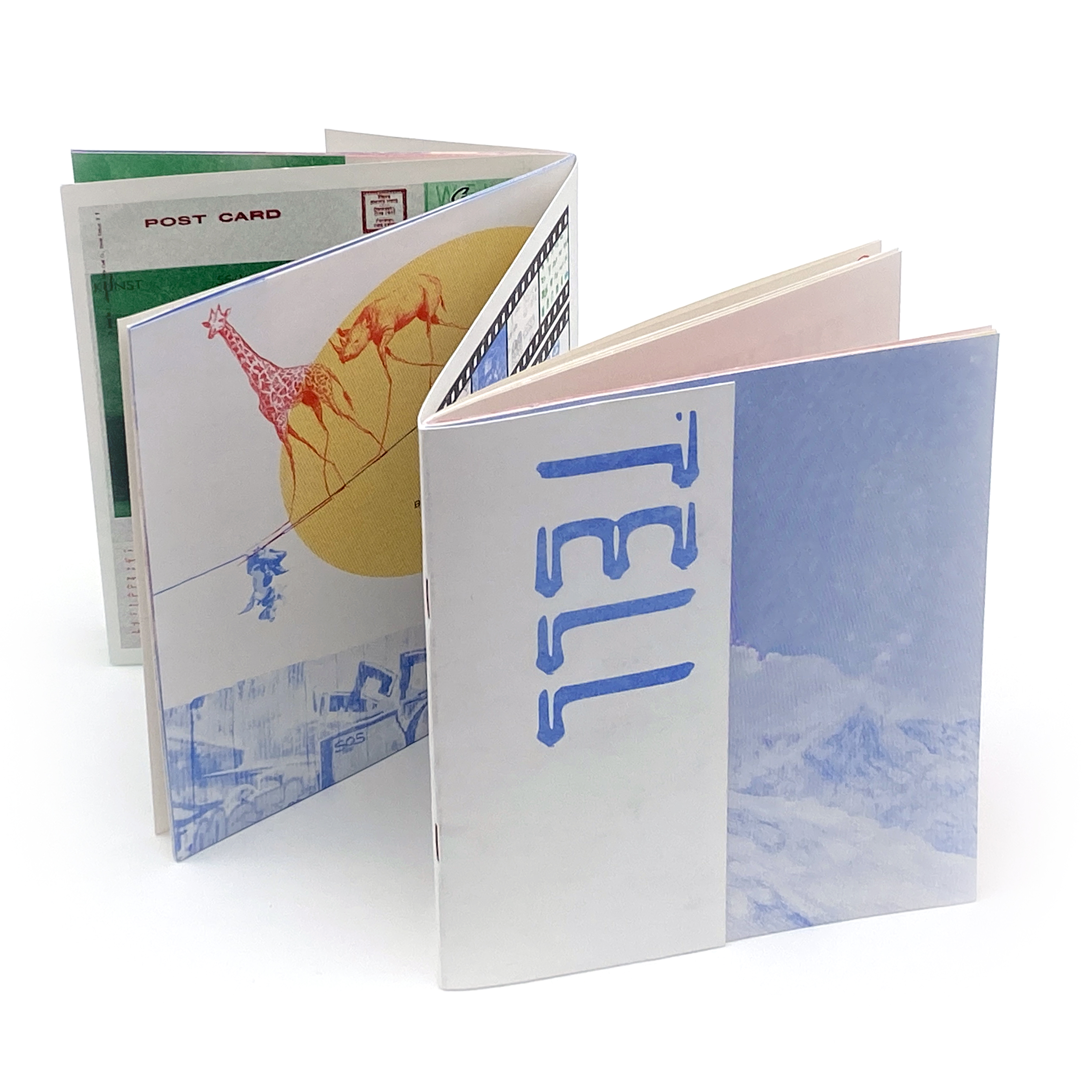 Photo of The Charrette student publication "Show and Tell" standing up with its pages open and unfolded like an accordian.
