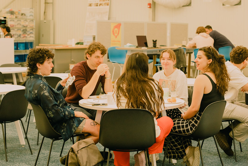 Students collaborating at table in Architecture school