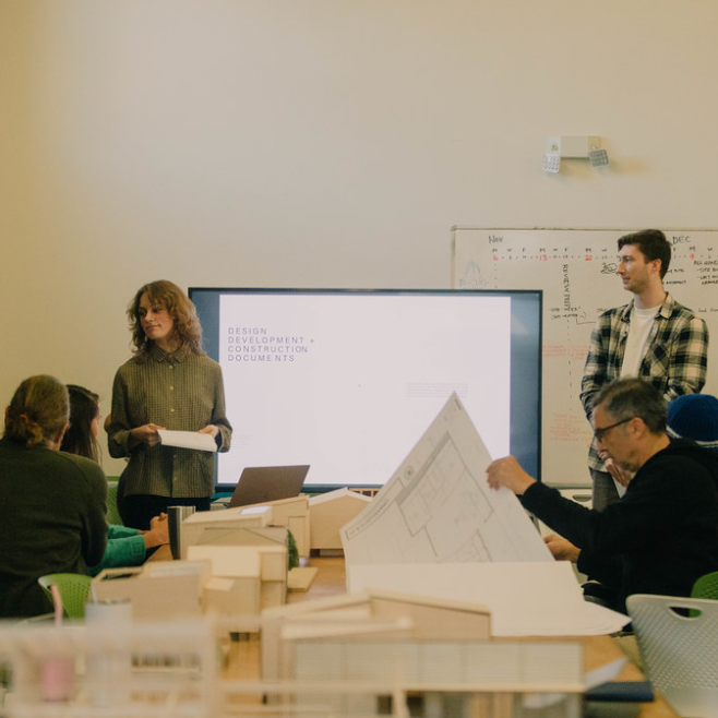 Group of people reviewing work 