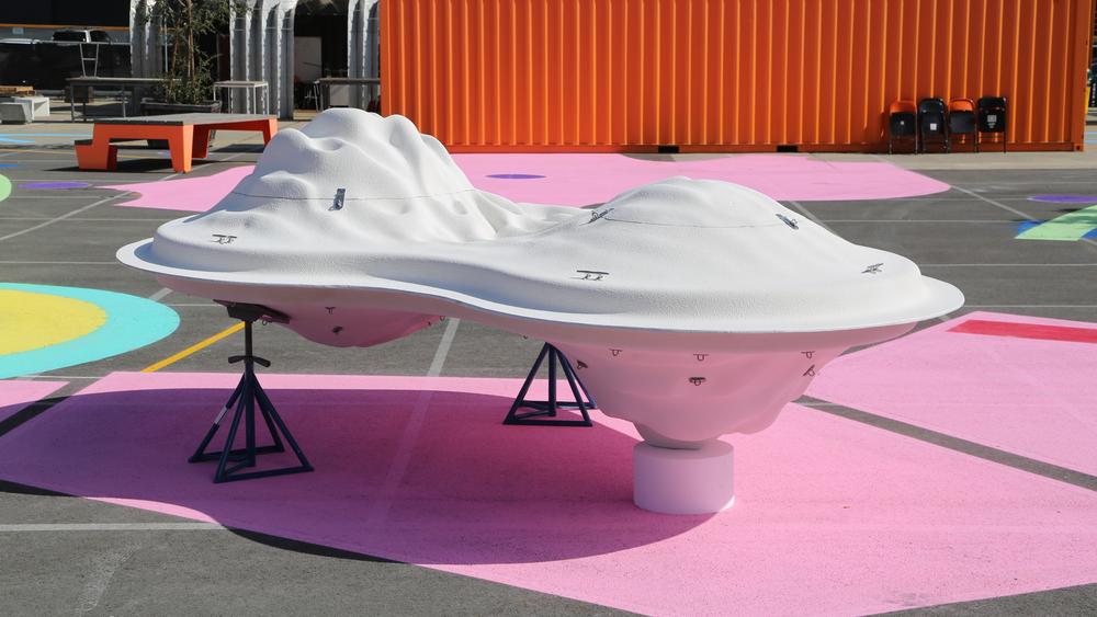 Picture of a large white float with a pink background 