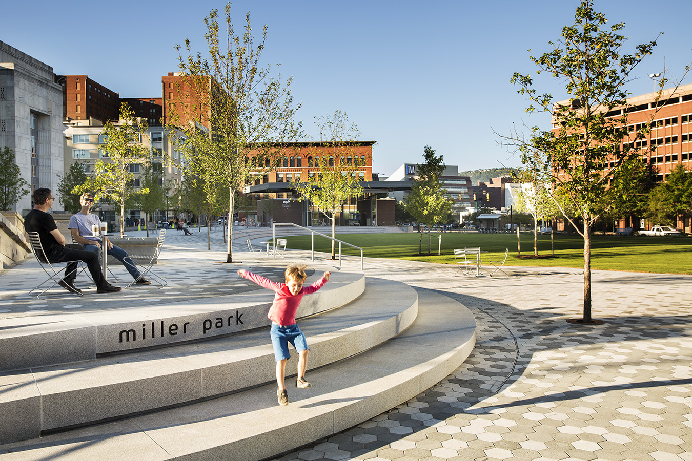 rendering of a large renovated park with child jumping 