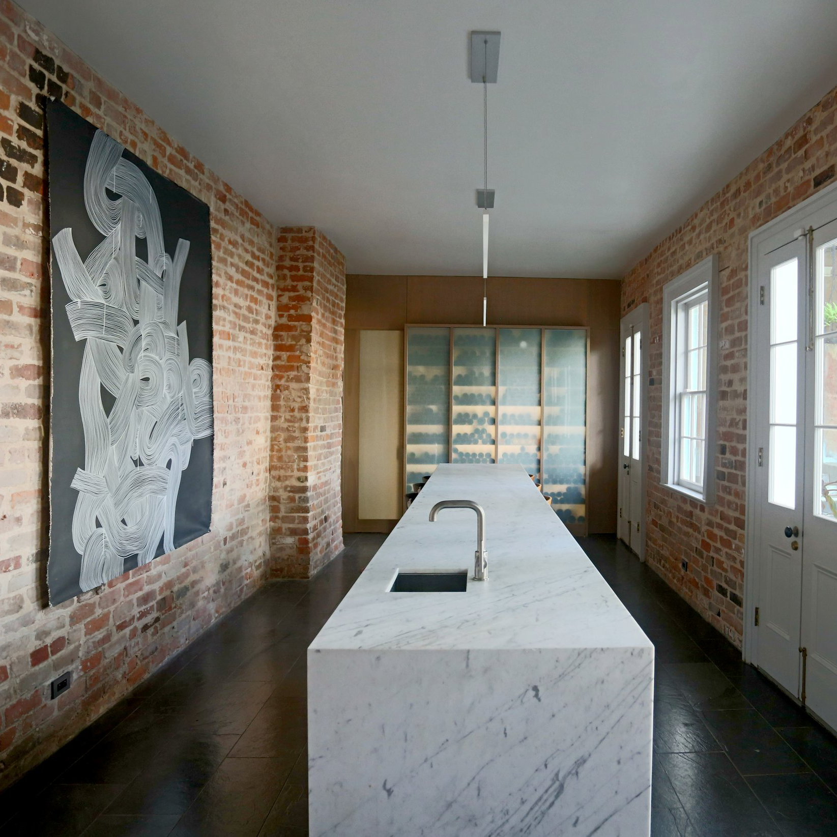 kitchen with countertop and brick wall