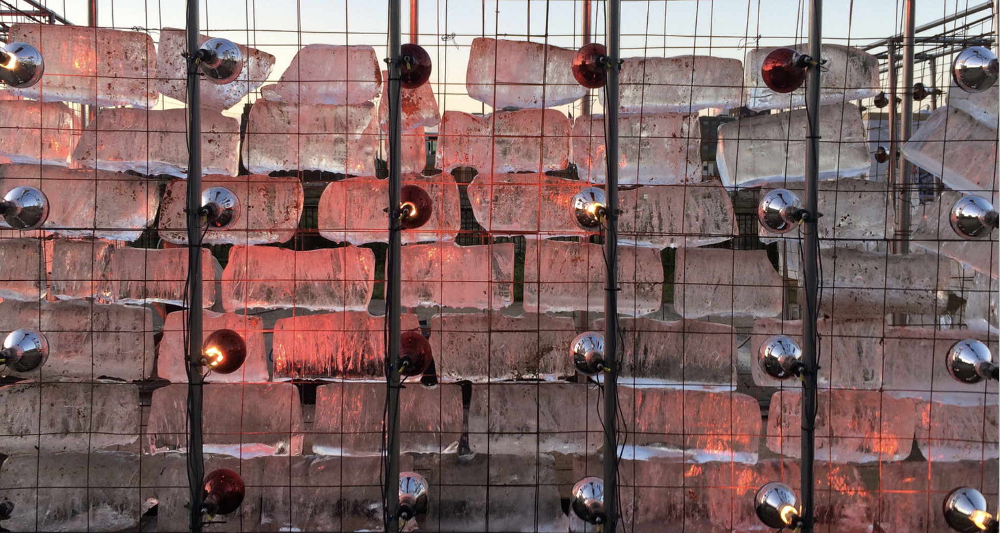 image of ice-like sculpture with red light and ornaments