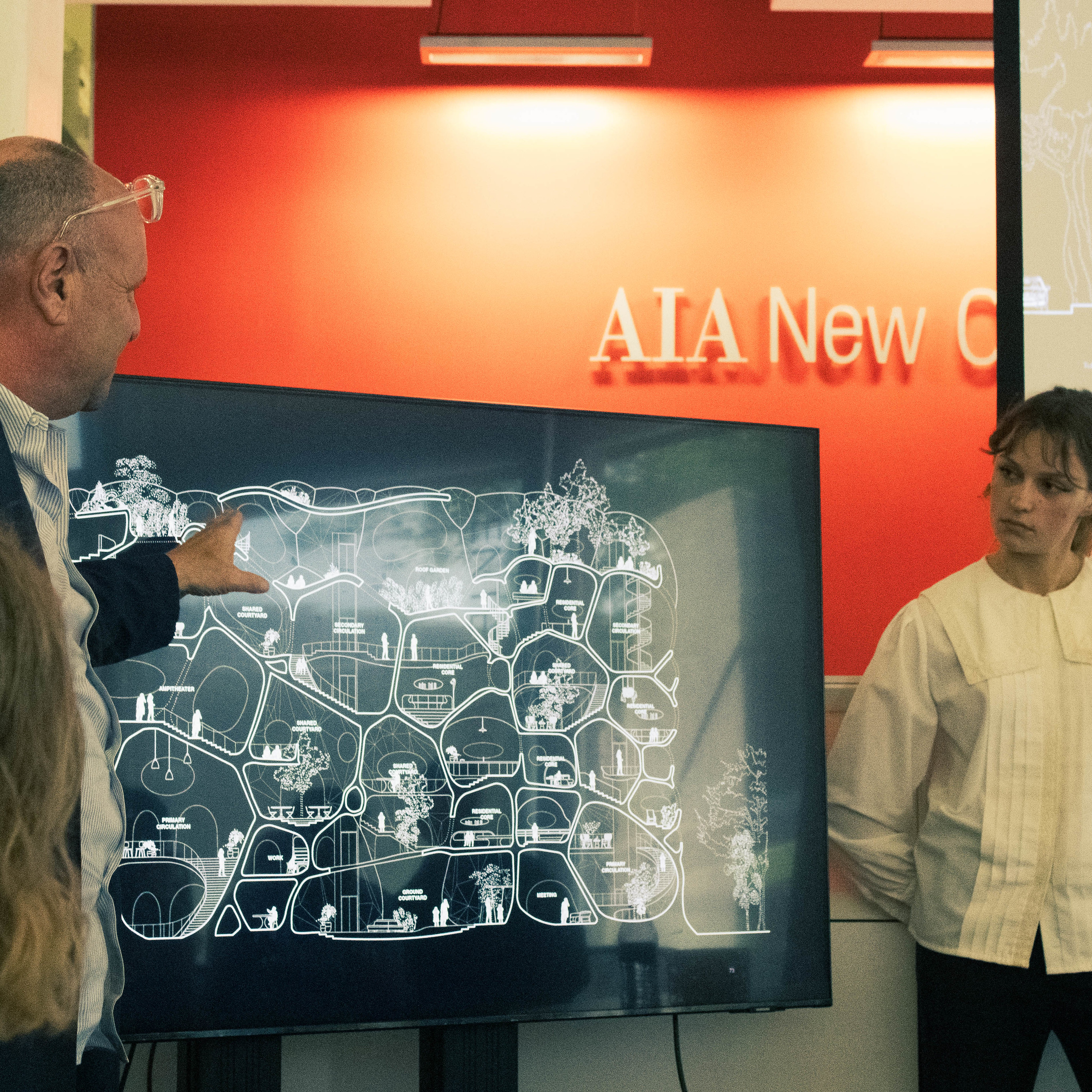 image of man presenting architecture with student