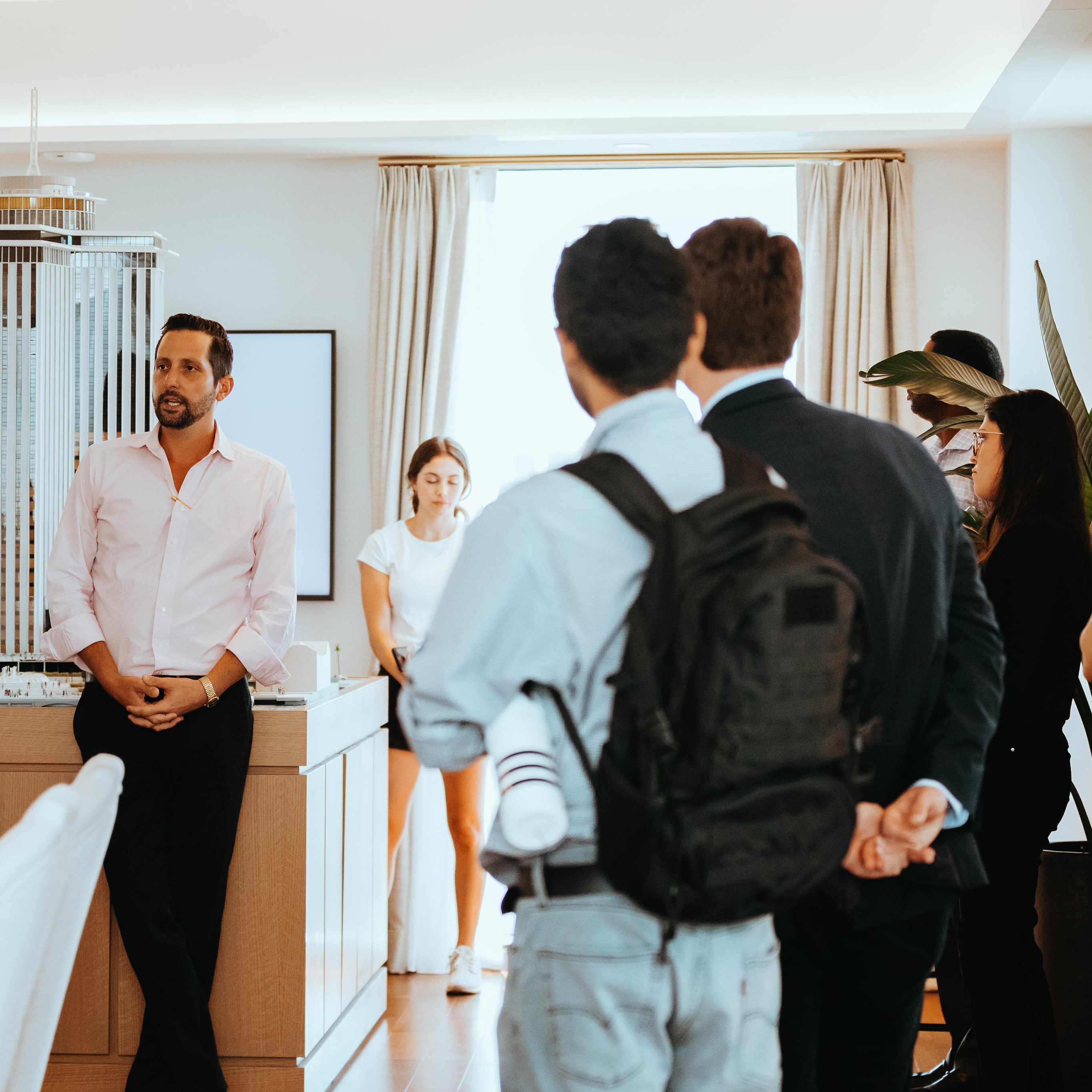 image of an open house, people paying attention to person talking