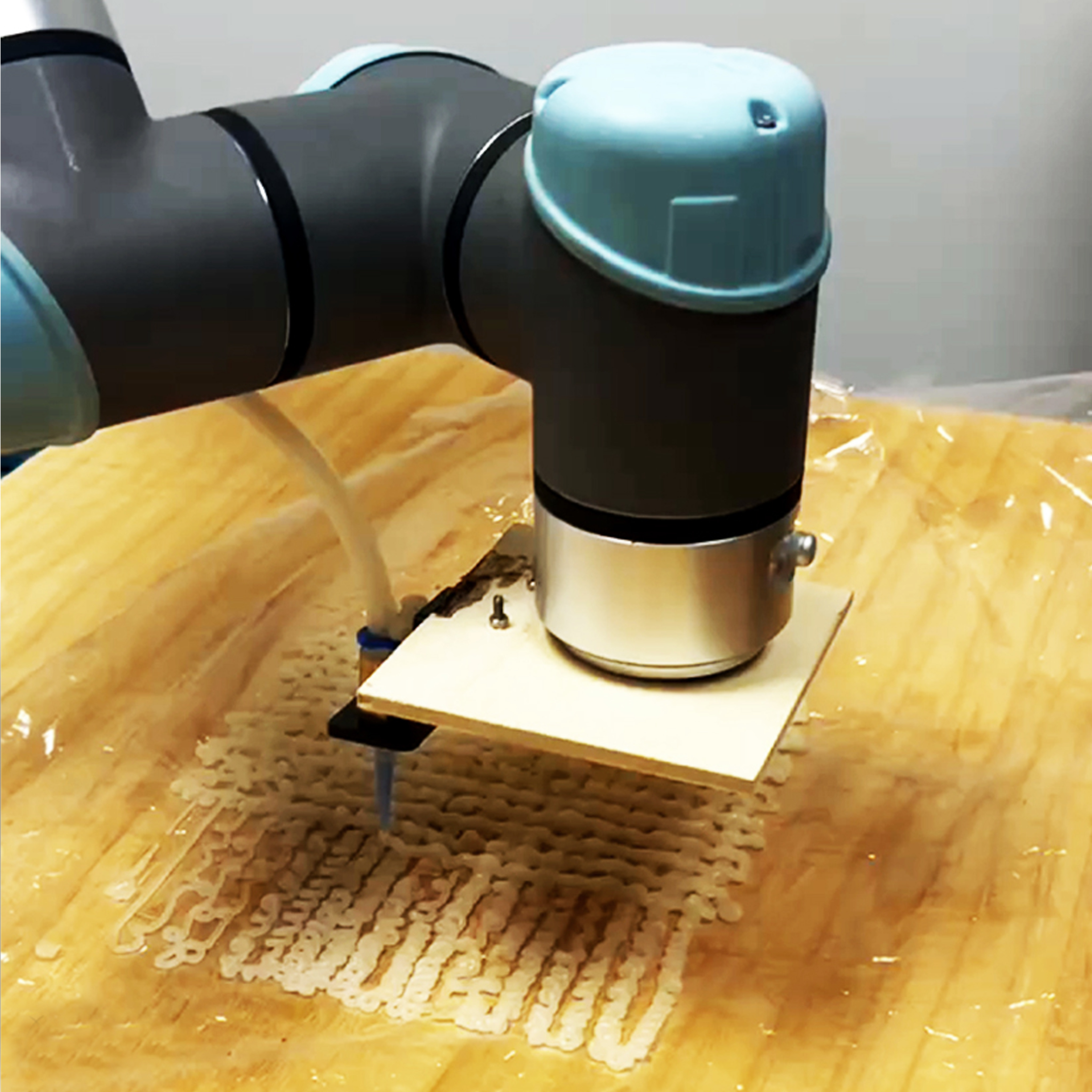 Robot arm representing research by faculty Mostafa Akbari.