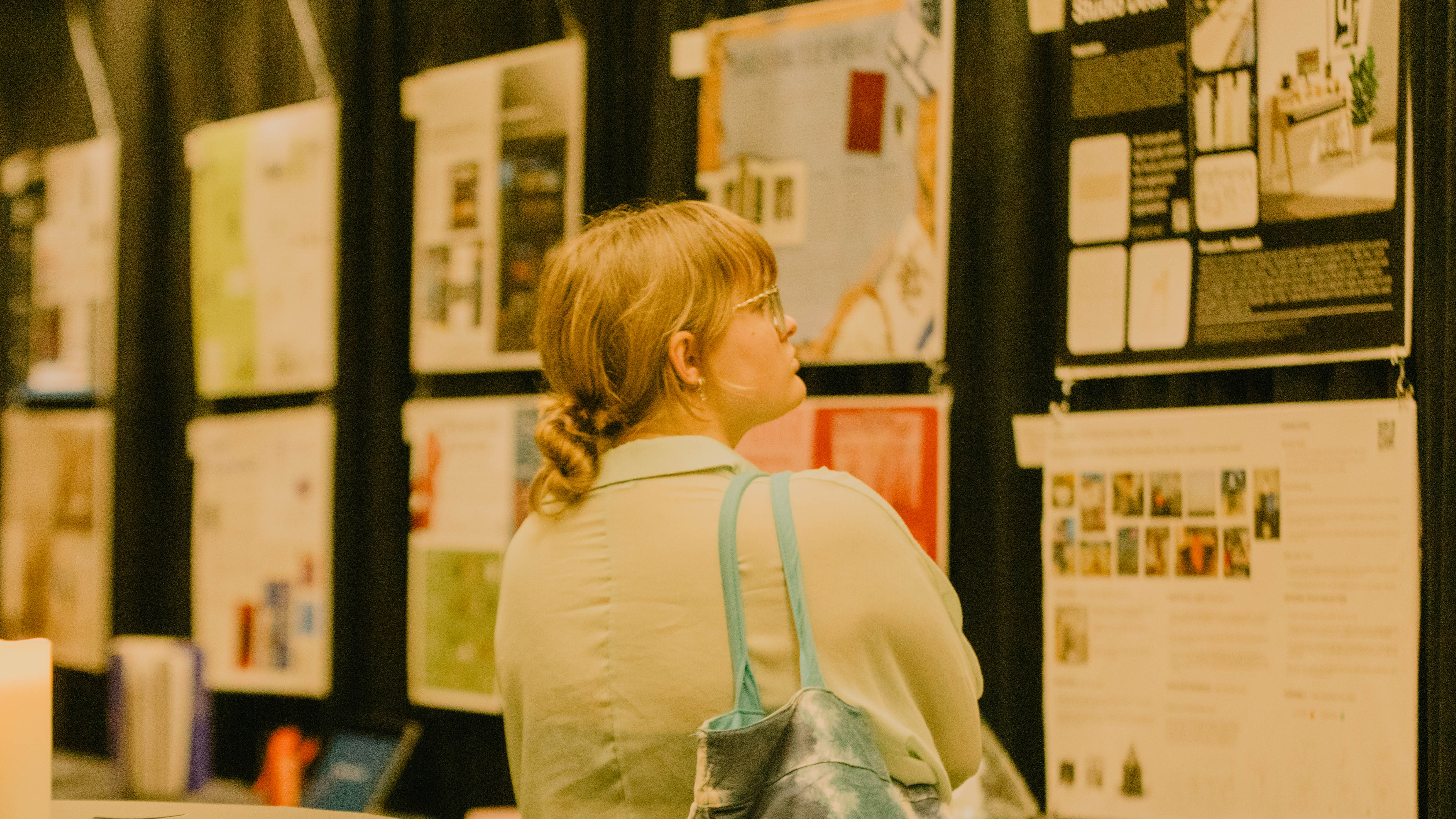 image of student looking at art pieces on the wall