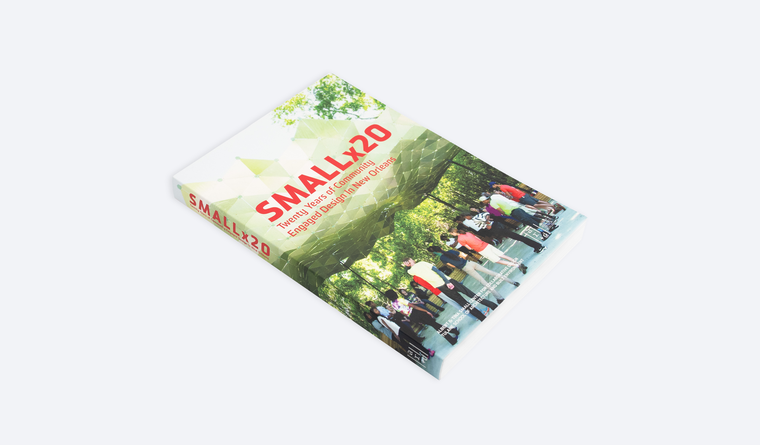 Angled view of the front cover of Small Center's book Smallx20, which focuses on its two decades of work.