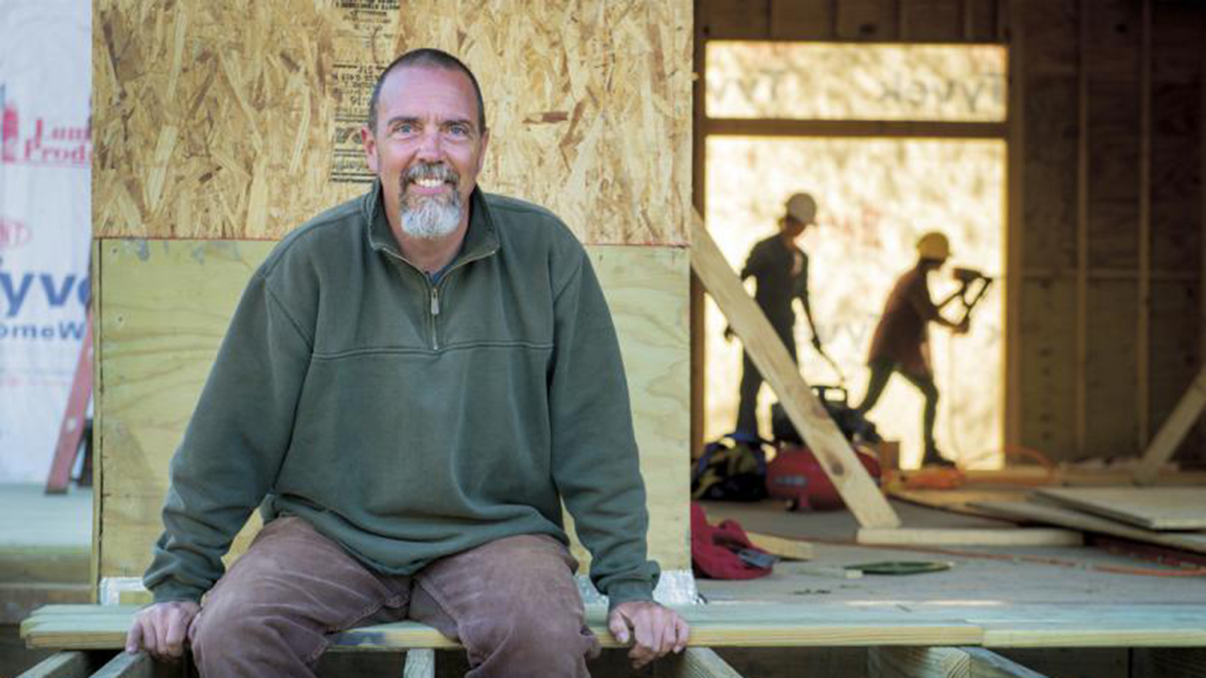 image of Ben Neal sitting in a building under construction