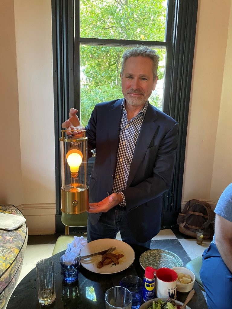 Anthony Robins showing his light fixture at "Out to Lunch"