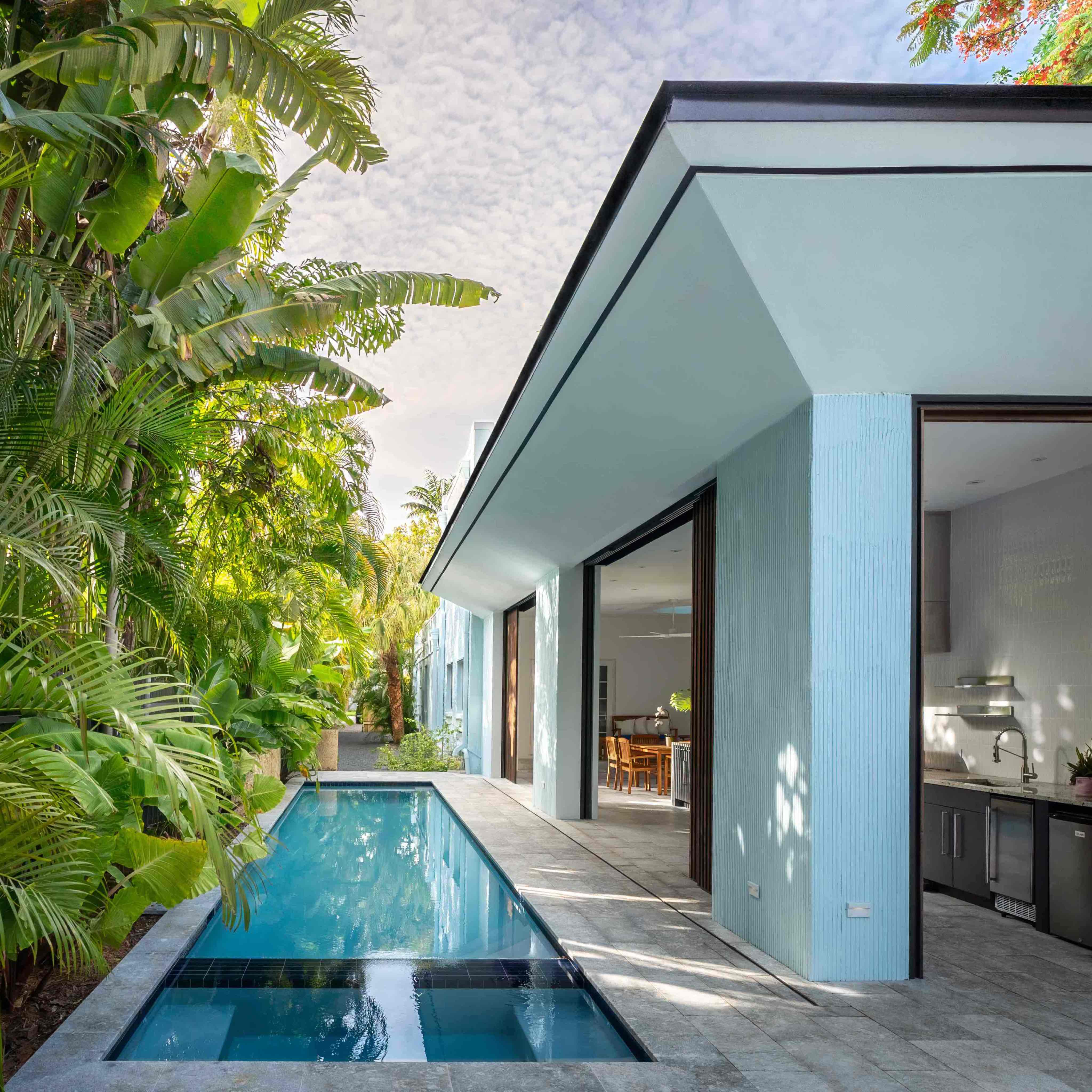 Square shot of Penumbra's kitchen and pool by Atelier Mey