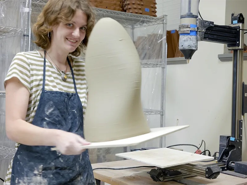A student at work in the TUSABE Clay Fabrication Lab