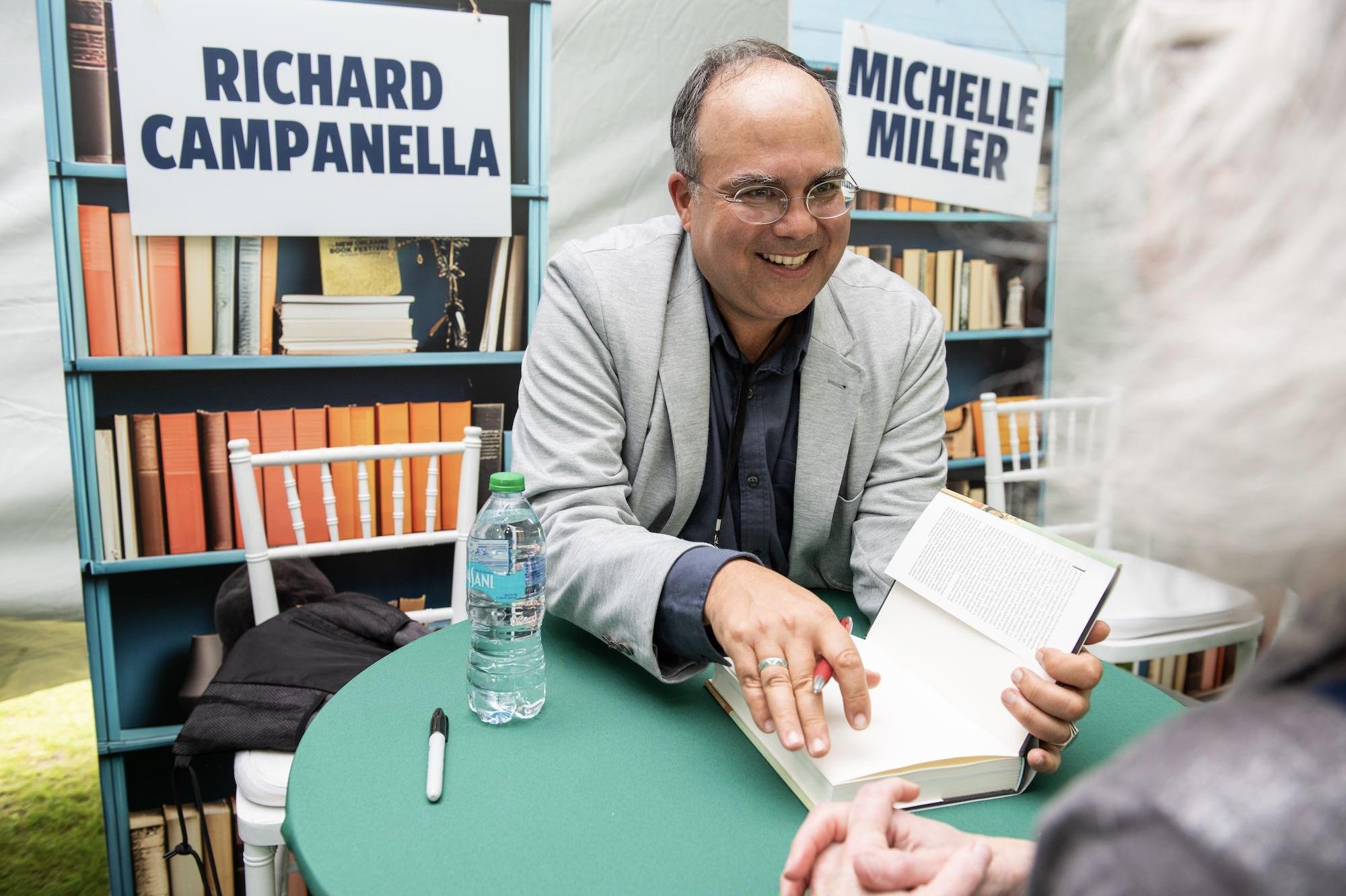 Shot of Richard Campanella signing a book at Tulane Book Fest