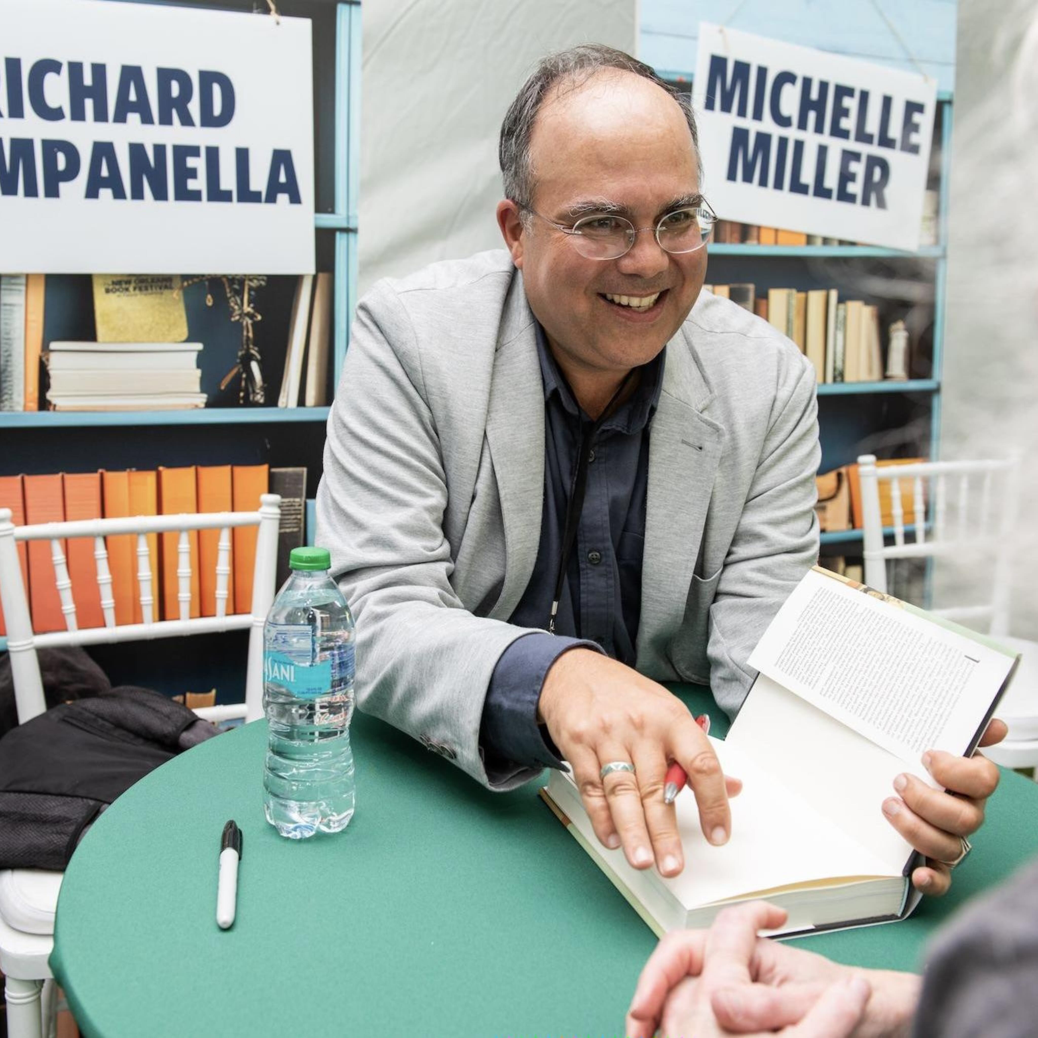 Shot of Richard Campanella signing a book at Tulane Book Fest