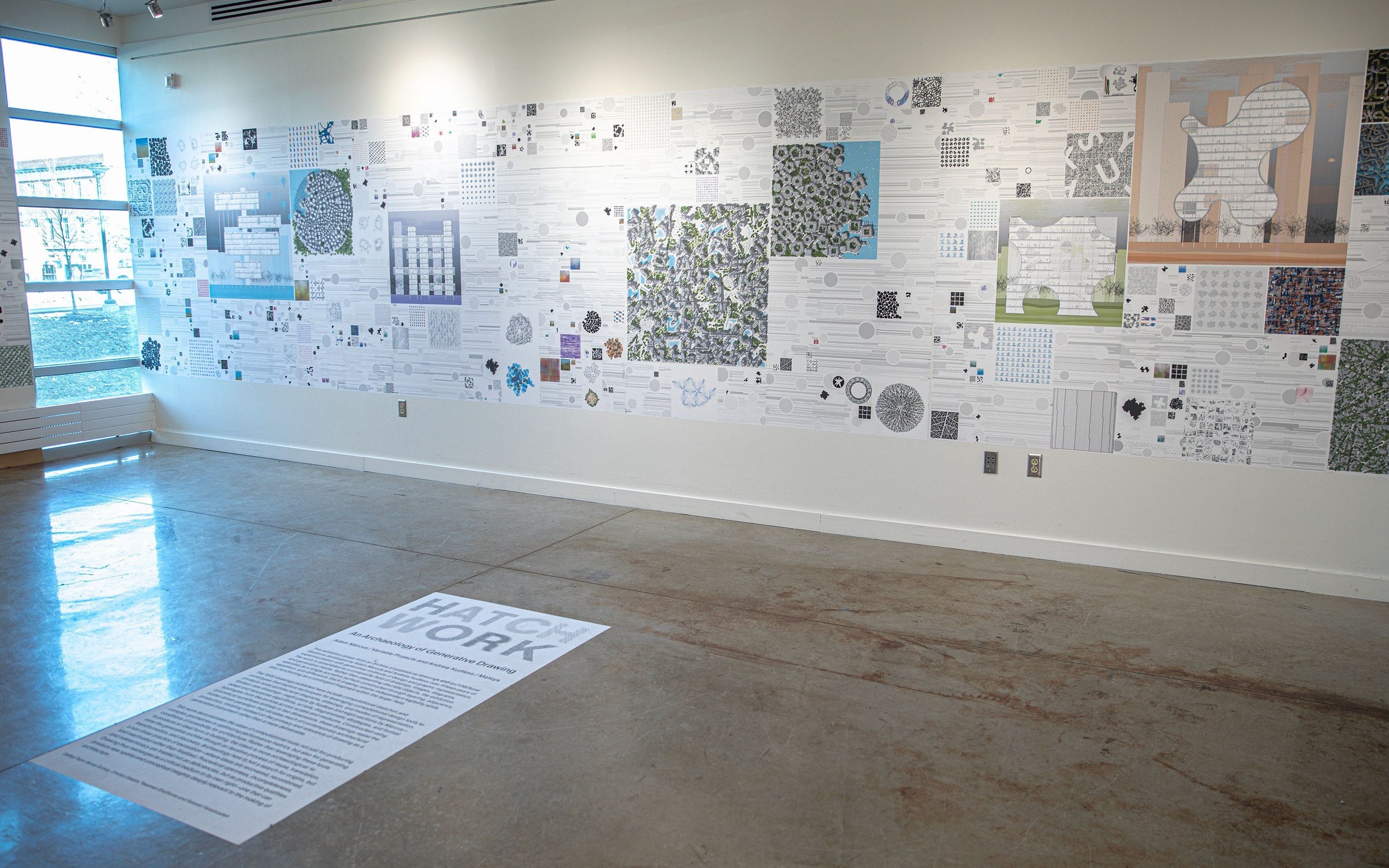 Alternate angle of the exhibition, with "HATCH WORK" written on the floor in front of the display