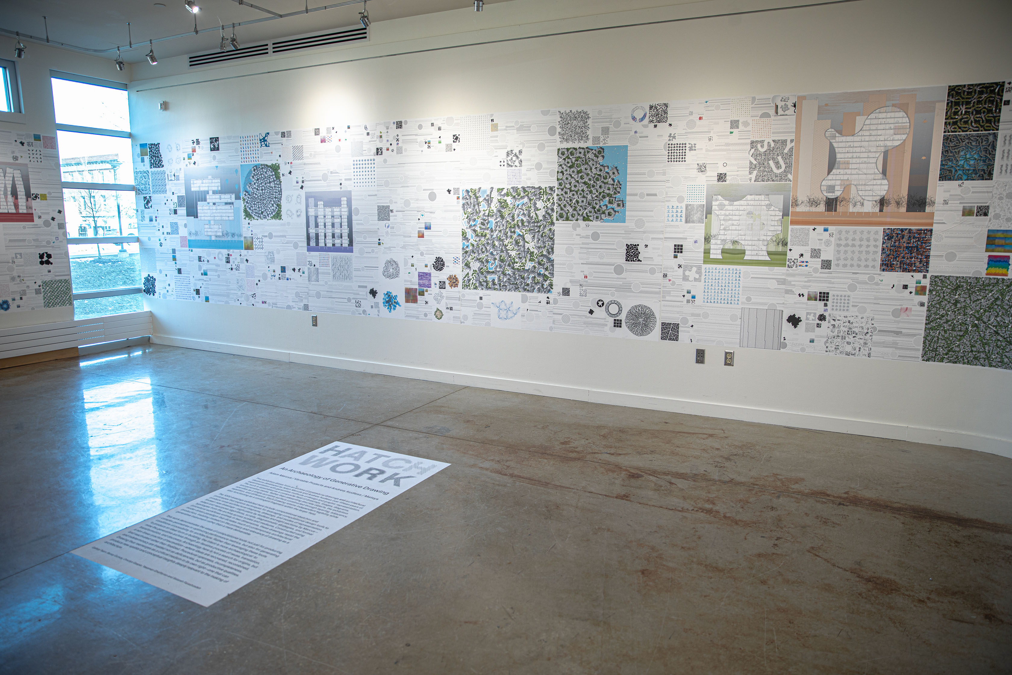 Alternate angle of the exhibition, with "HATCH WORK" written on the floor in front of the display