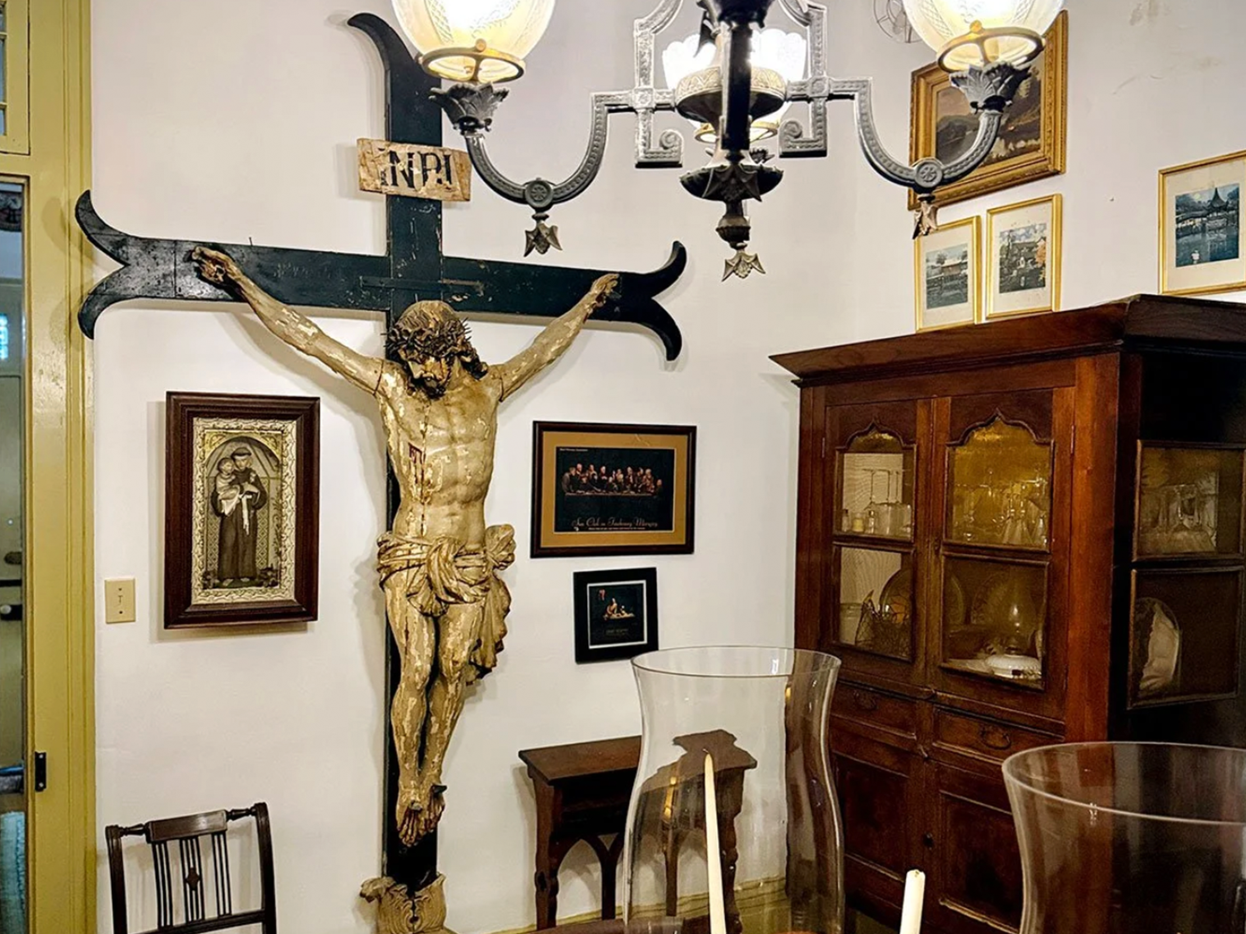 Photo showing large crucifix on the wall in Gene Cizek's dining room.