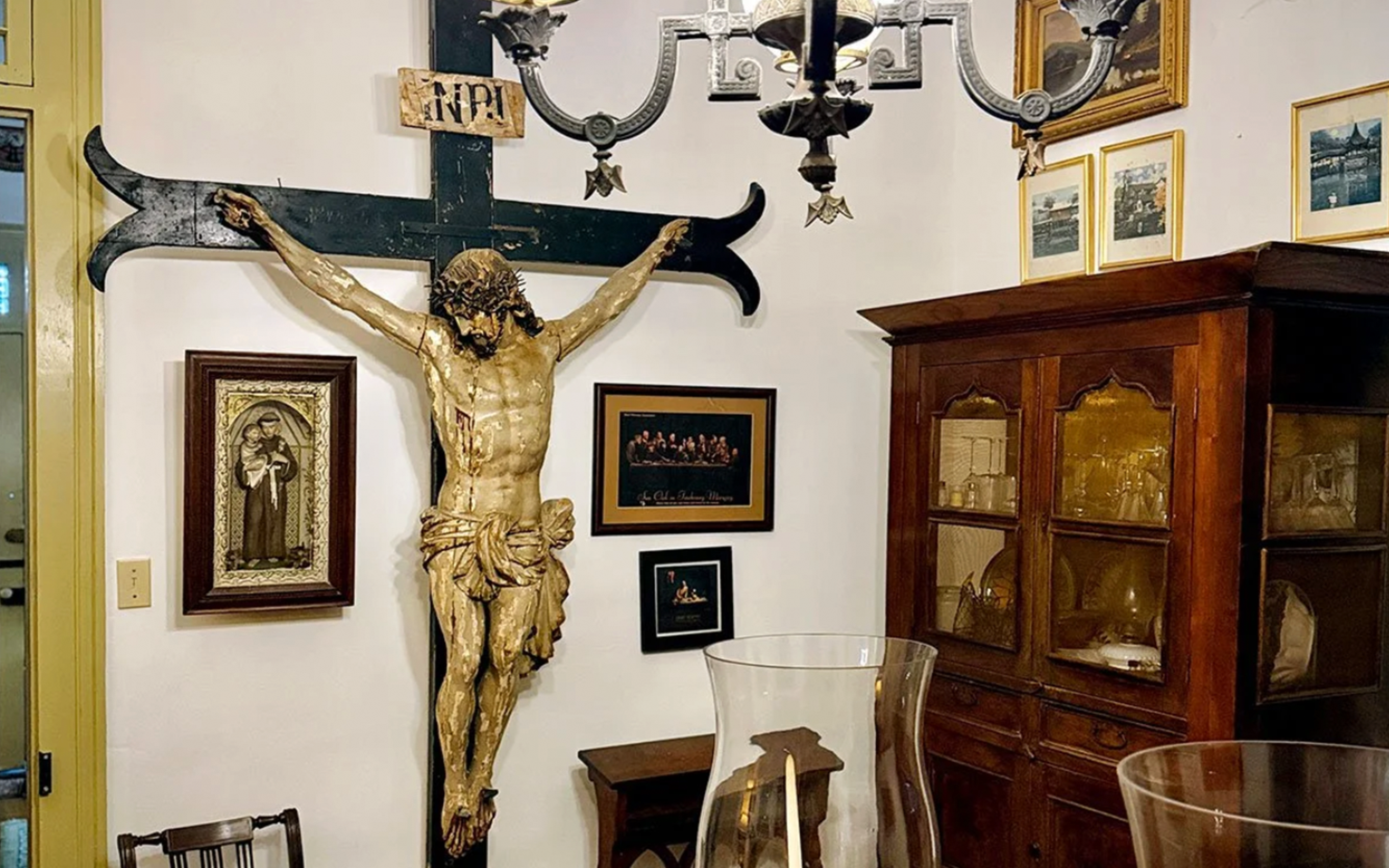 Photo showing large crucifix on the wall in Gene Cizek's dining room.