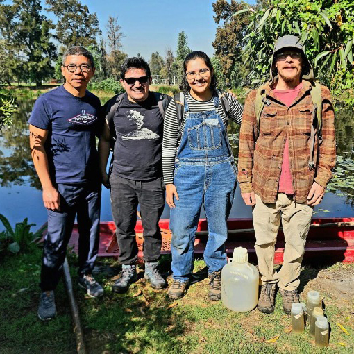 Photo of researchers in front of a stream