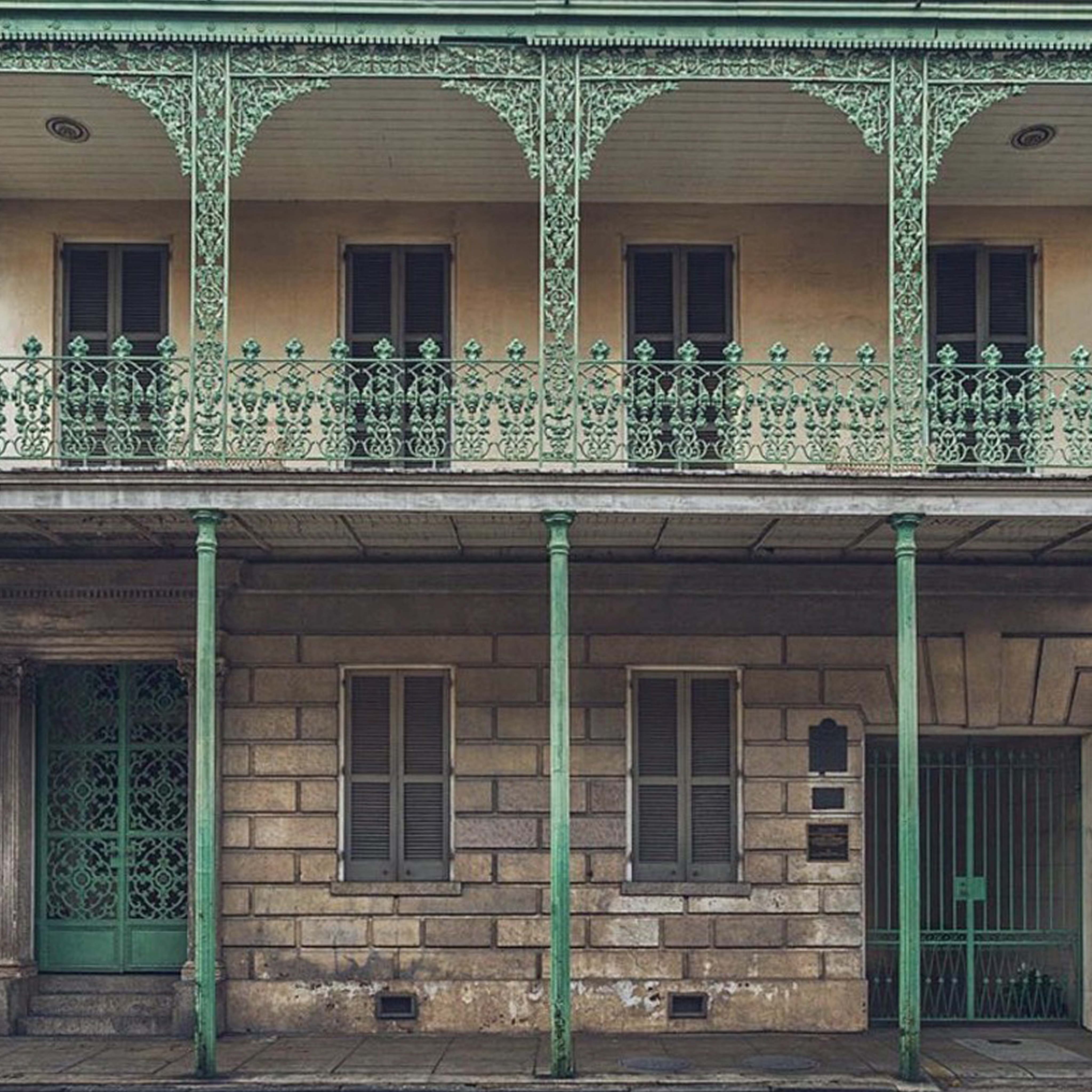 photo of ornate wrough iron balcony on a traditional home