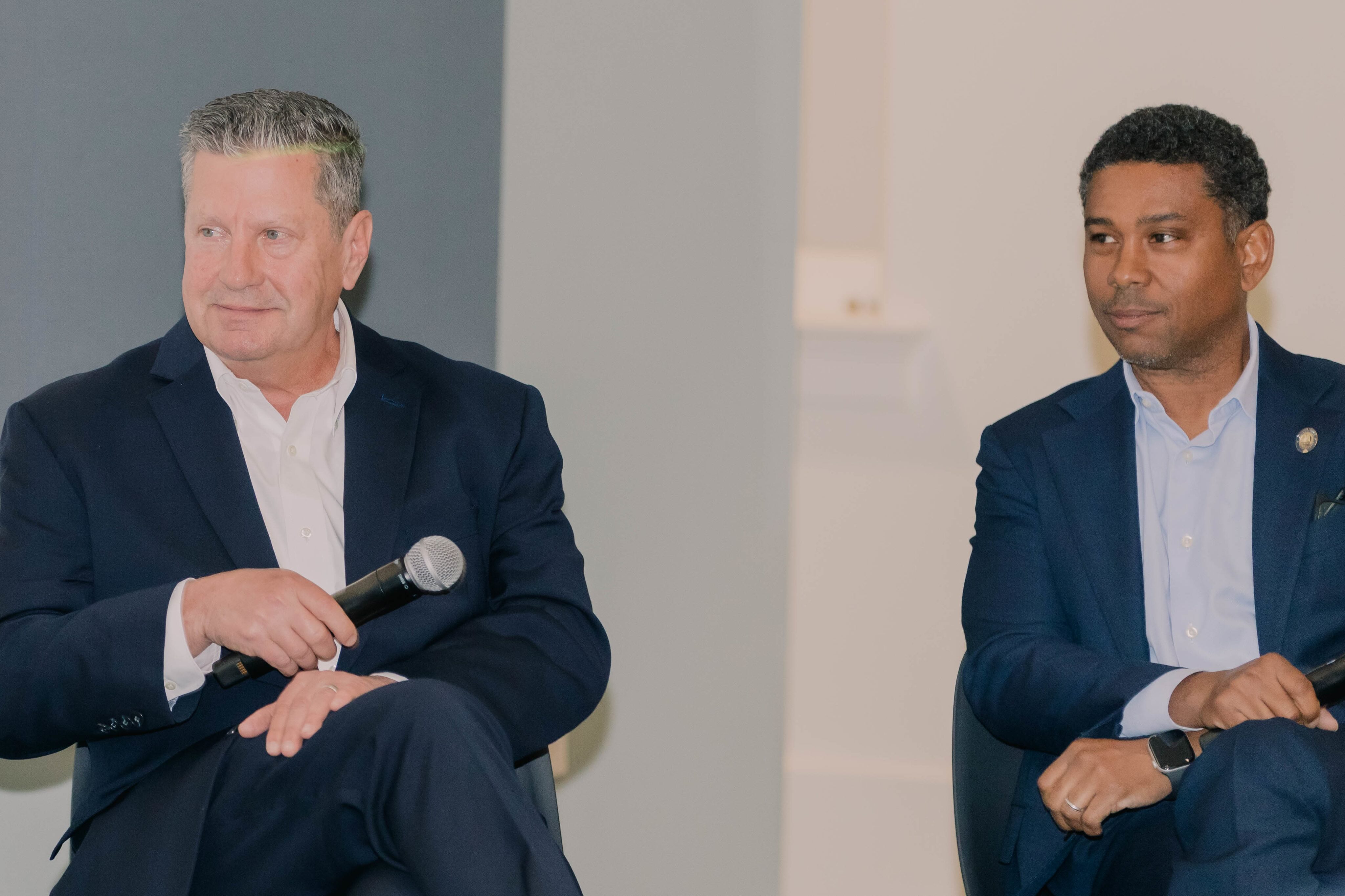Louisiana Senators Patrick Connick and Gary Carter Jr. sit in a classroom in RMH for a panel discussion