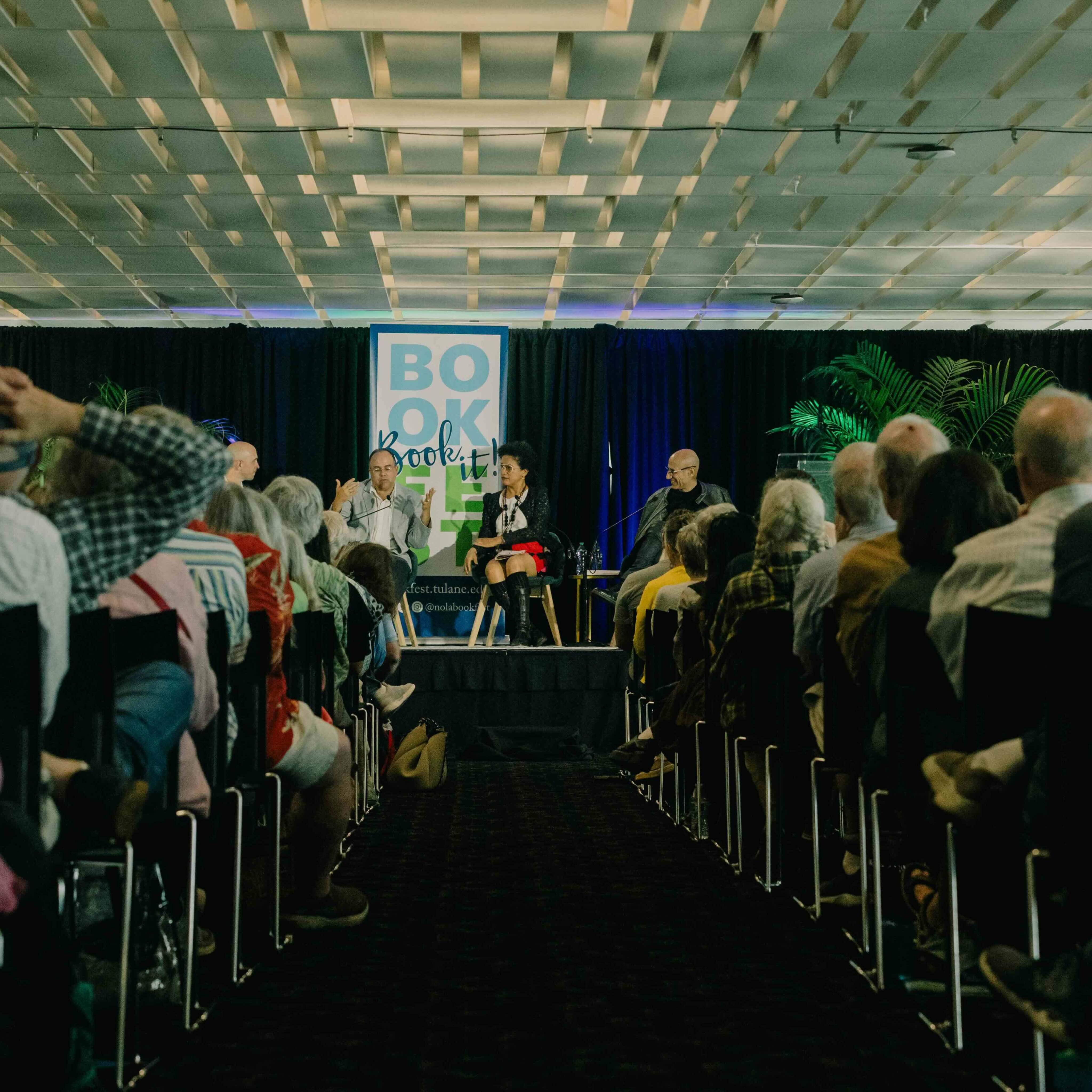 speakers on the stage at new orleans book festival