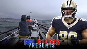 Cover image of NFL Film on Jimmy Graham and Arctic Challenge showing Graham in football uniform and team on boat in Arctic Ocean