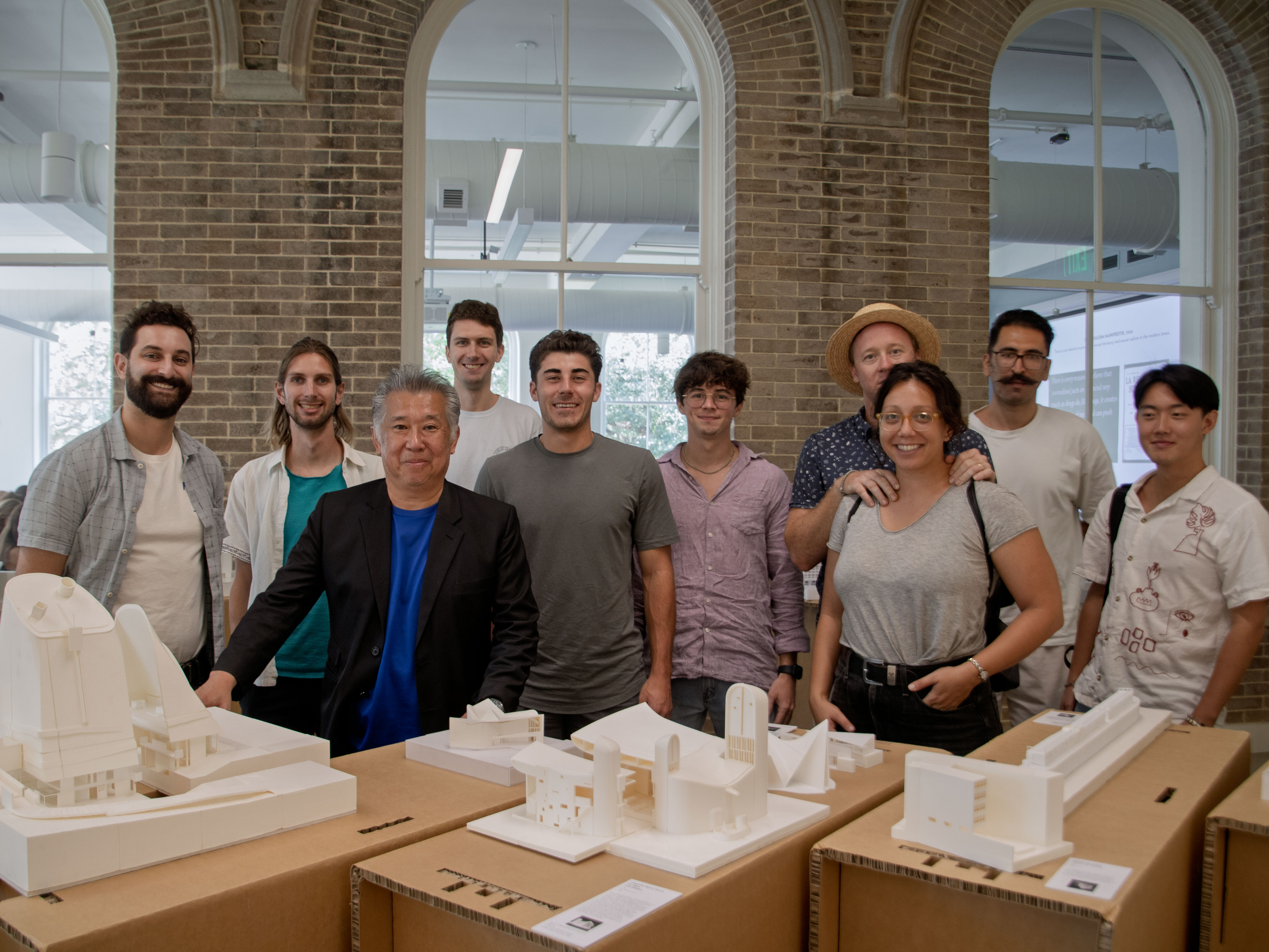 Presenters standing in front of models