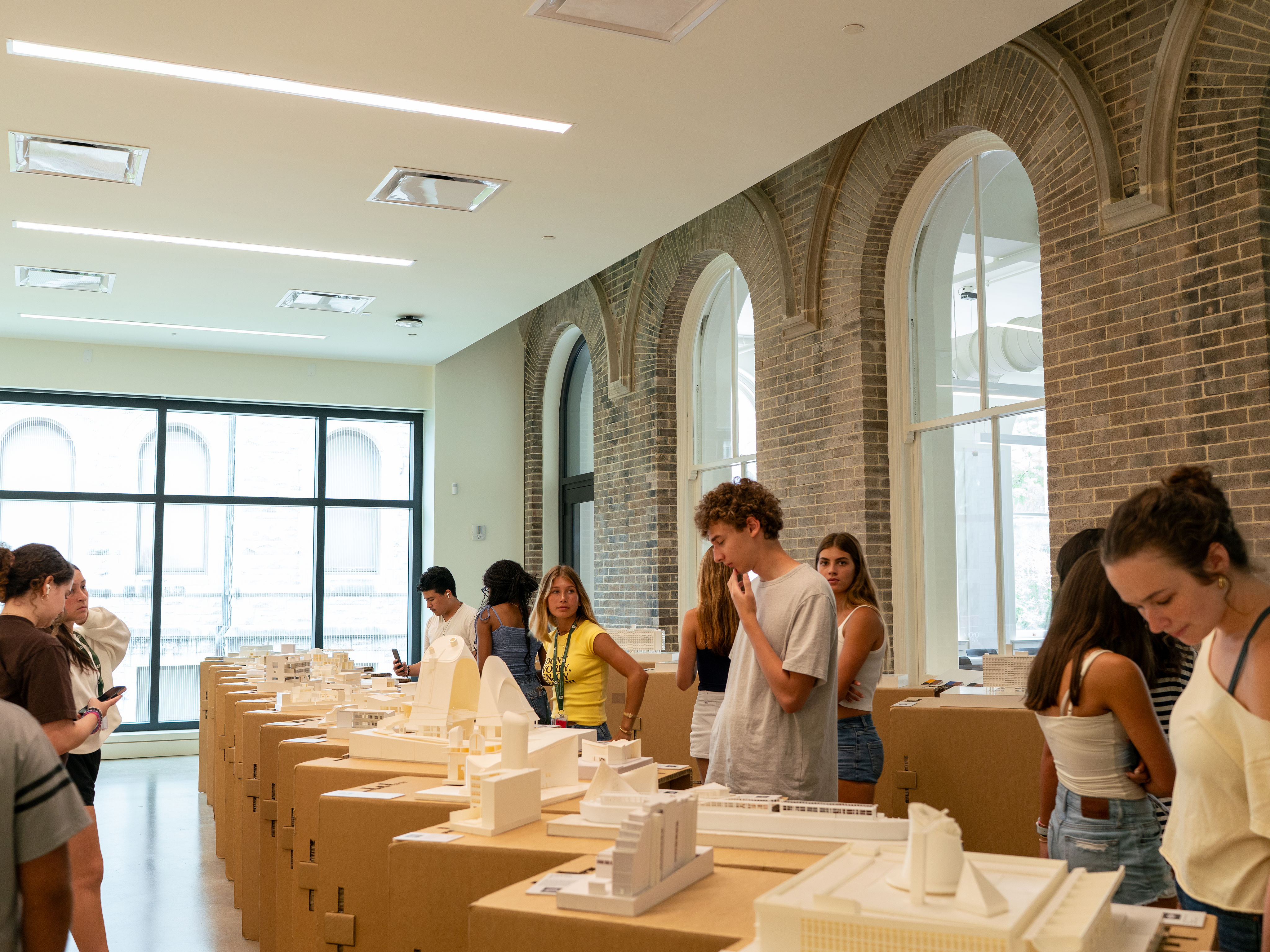 Students looking at display of models