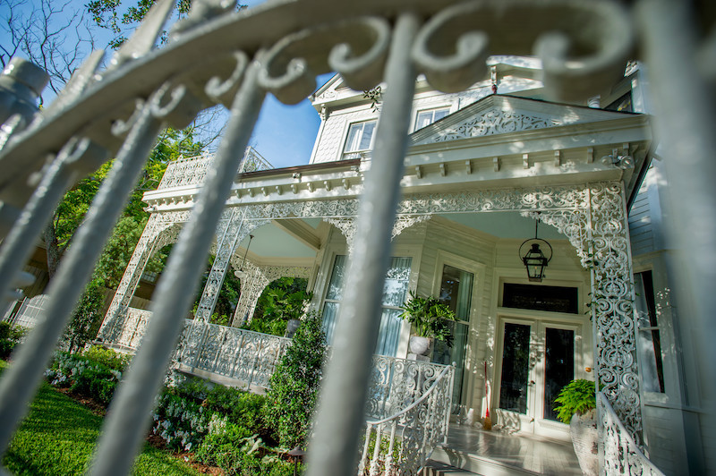 Decorative ironwork adorns a historic home along St. Charles Avenue near Tulane University's uptown campus. Ornamental iron balconies, fences and galleries are among the architectural features that distinguish New Orleans' historic neighborhoods. (Photo by Paula Burch-Celentano)