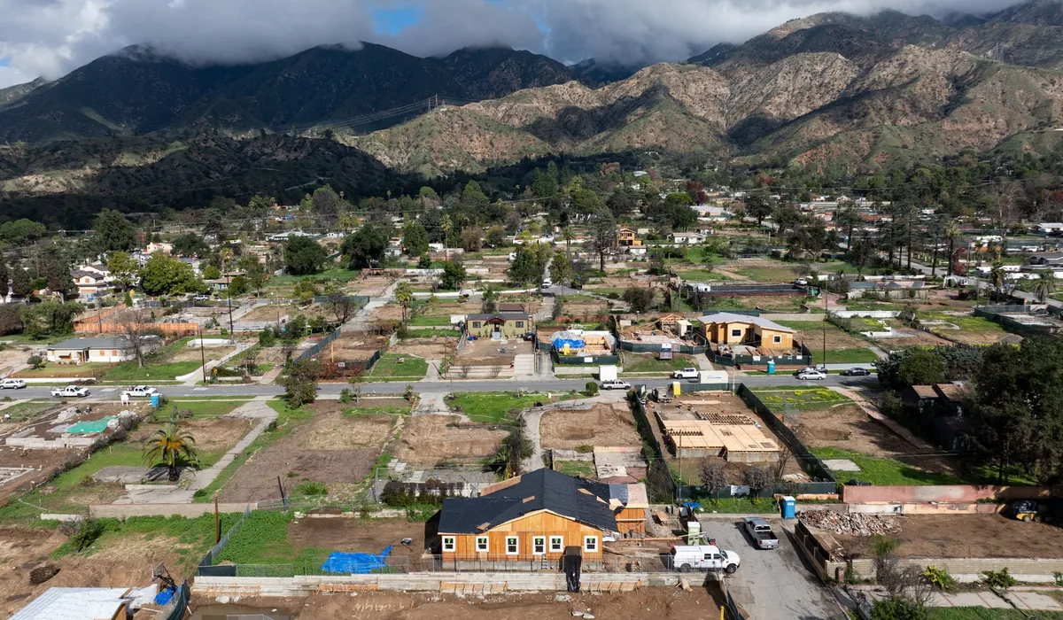 Homes under construction and empty lots destroyed by the 2025 Eaton Fire in Altadena, California, a year later in January 2026.Photographer: Josh Edelson/AFP/Getty Images