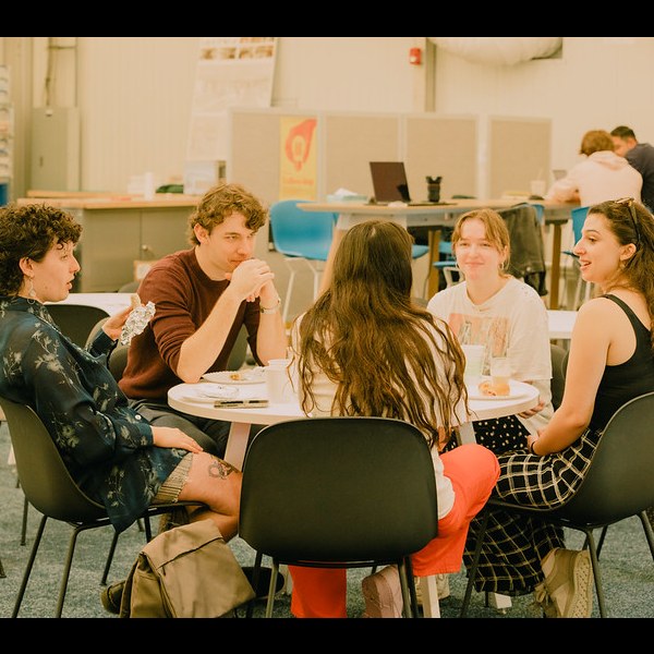 Students collaborating at table in Architecture school