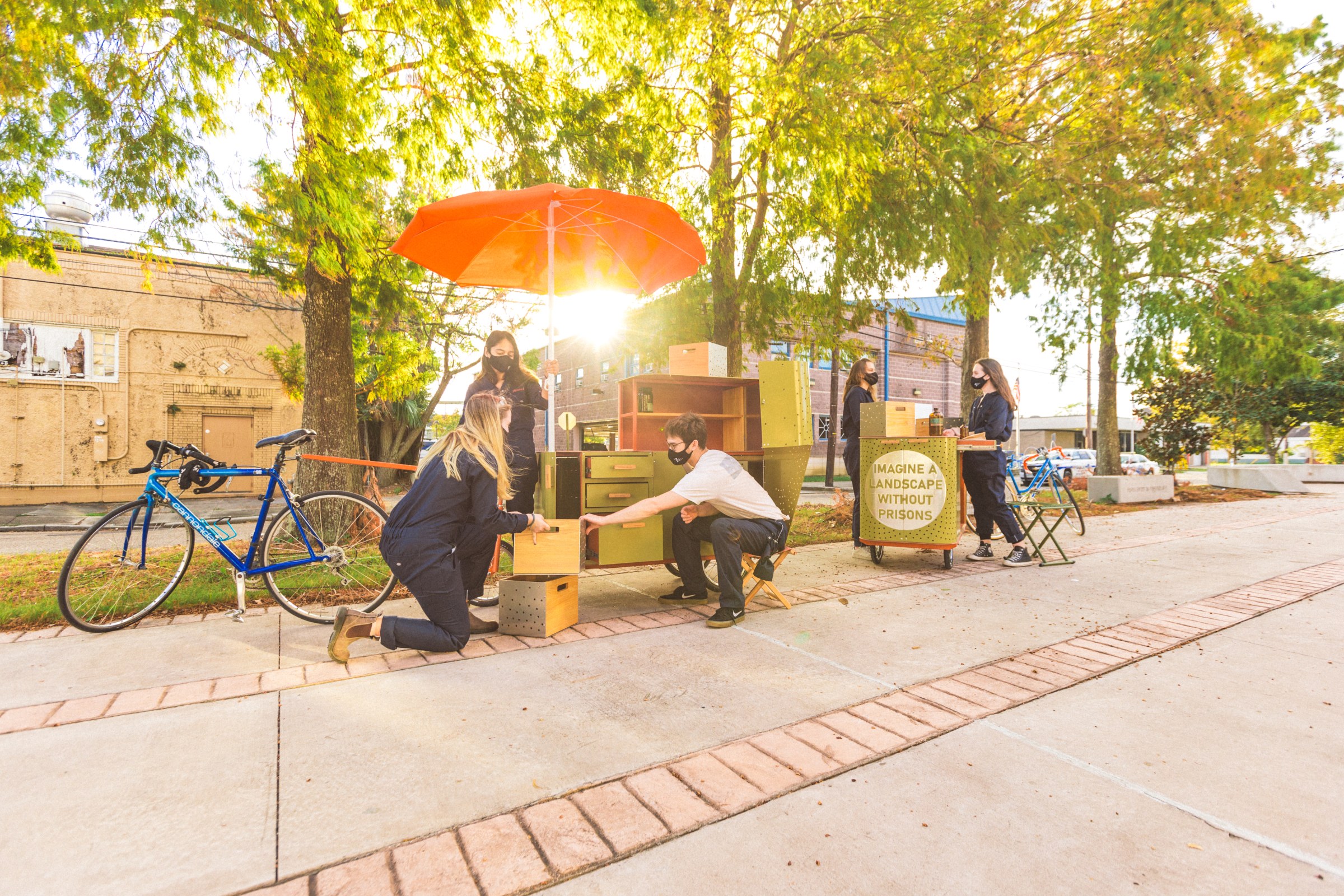 Sunny day , boy and girl performing something  in road side and also bicycle showing