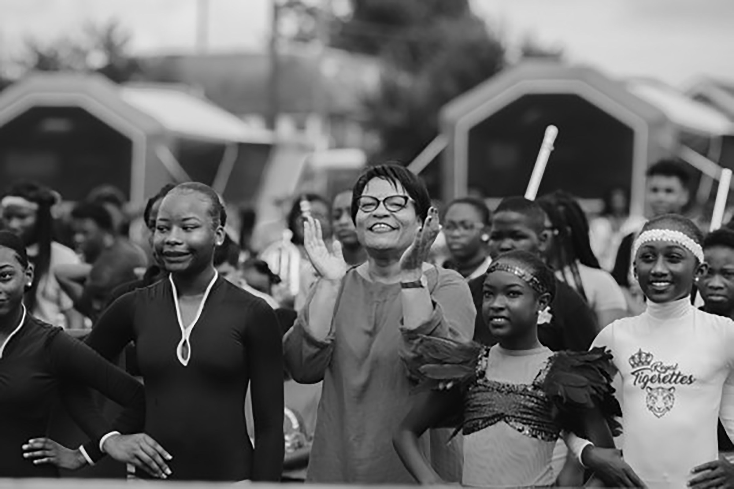 Photo of Mayer Latoya Cantrell alongside New Orleans children and natives marching in parade
