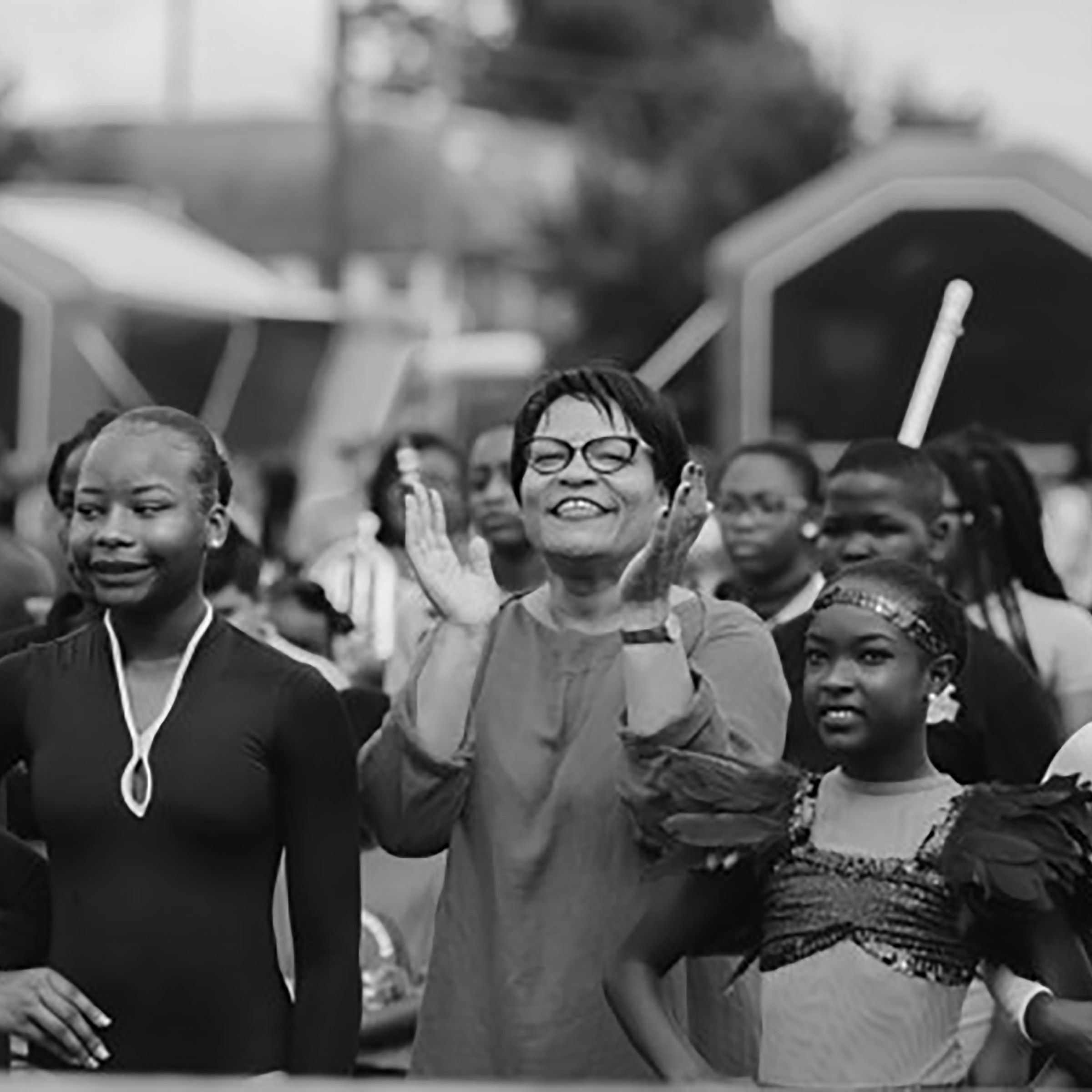 Photo of Mayer Latoya Cantrell alongside New Orleans children and natives marching in parade