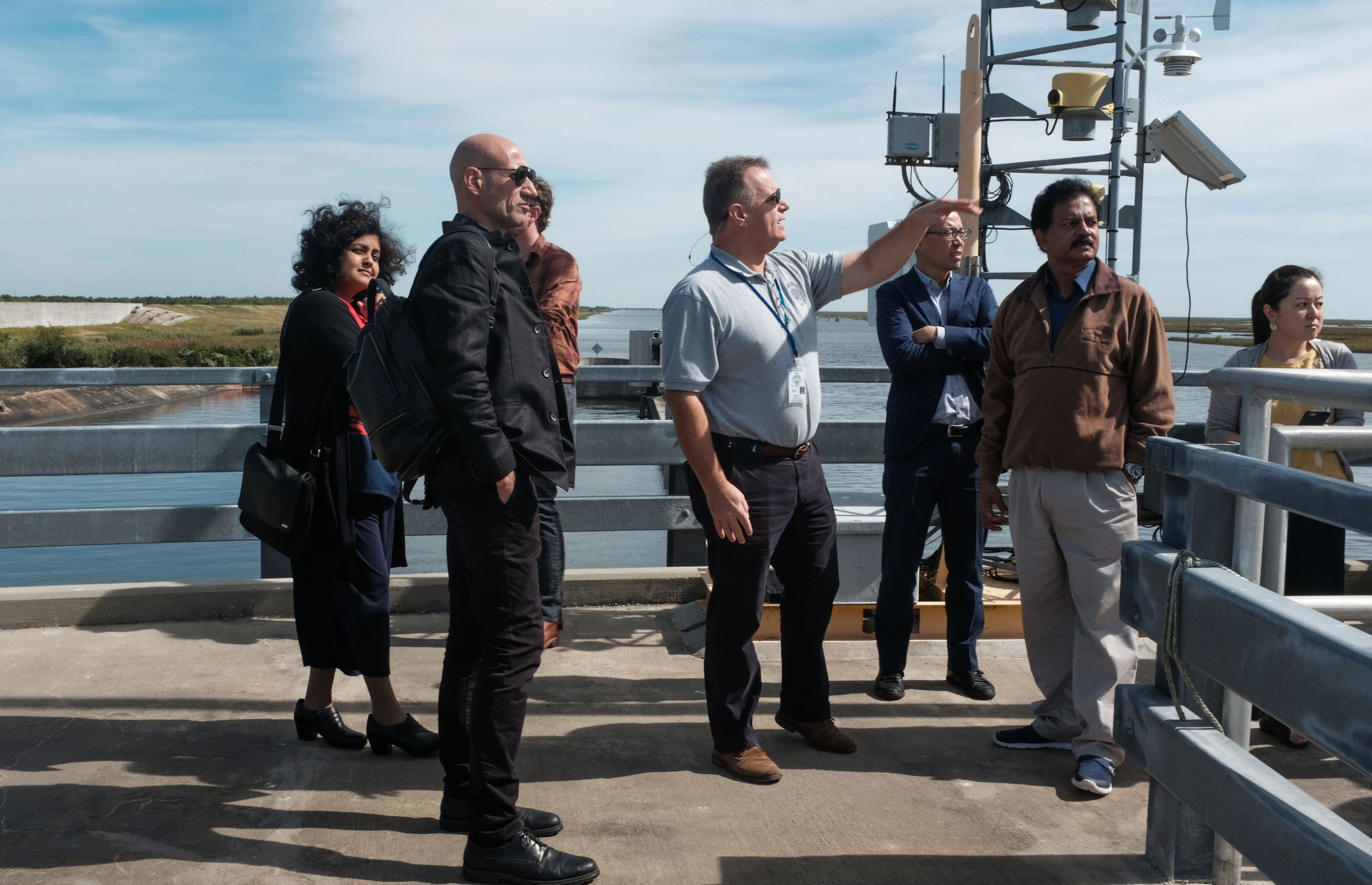 Group of people on water surge project