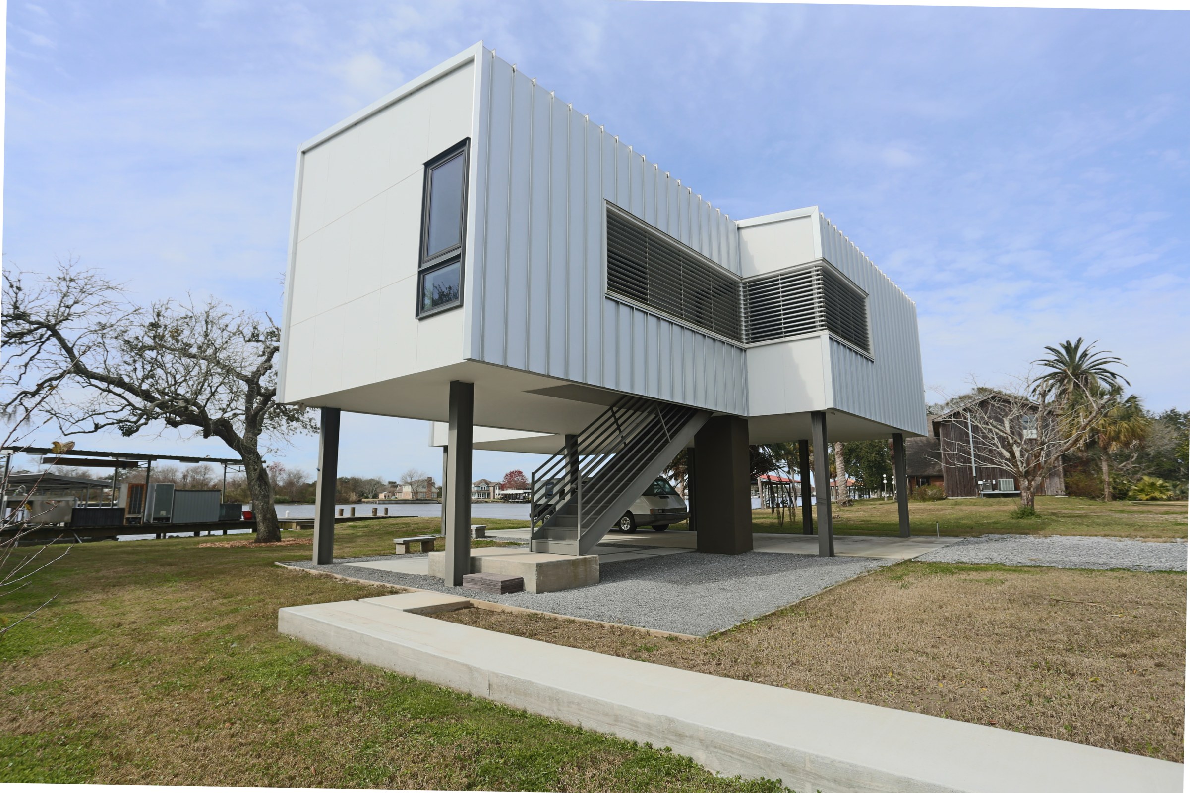 Single-story modern style home, elevated one floor off a slab