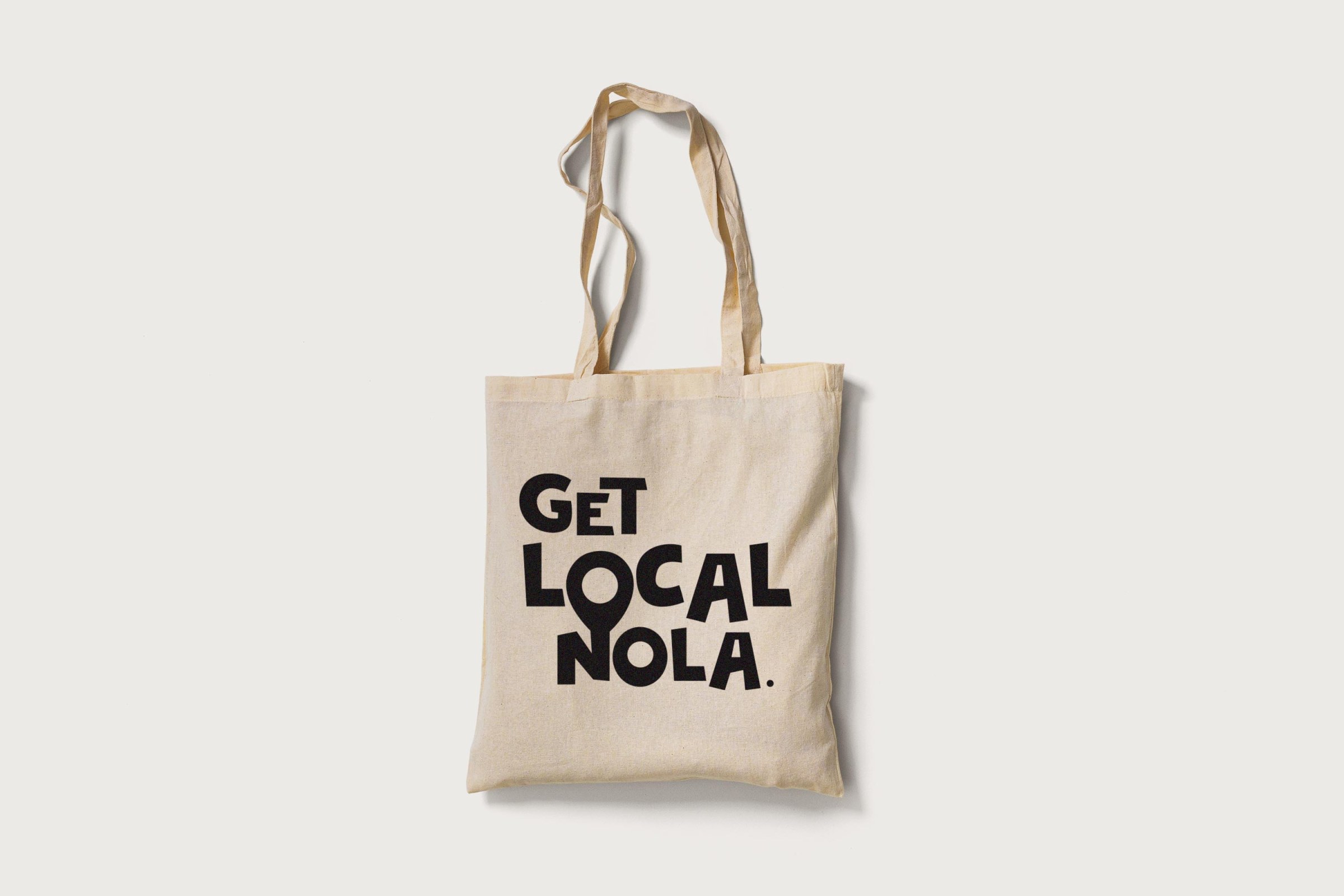Mockup of tote bag with "Get Local Nola" logo