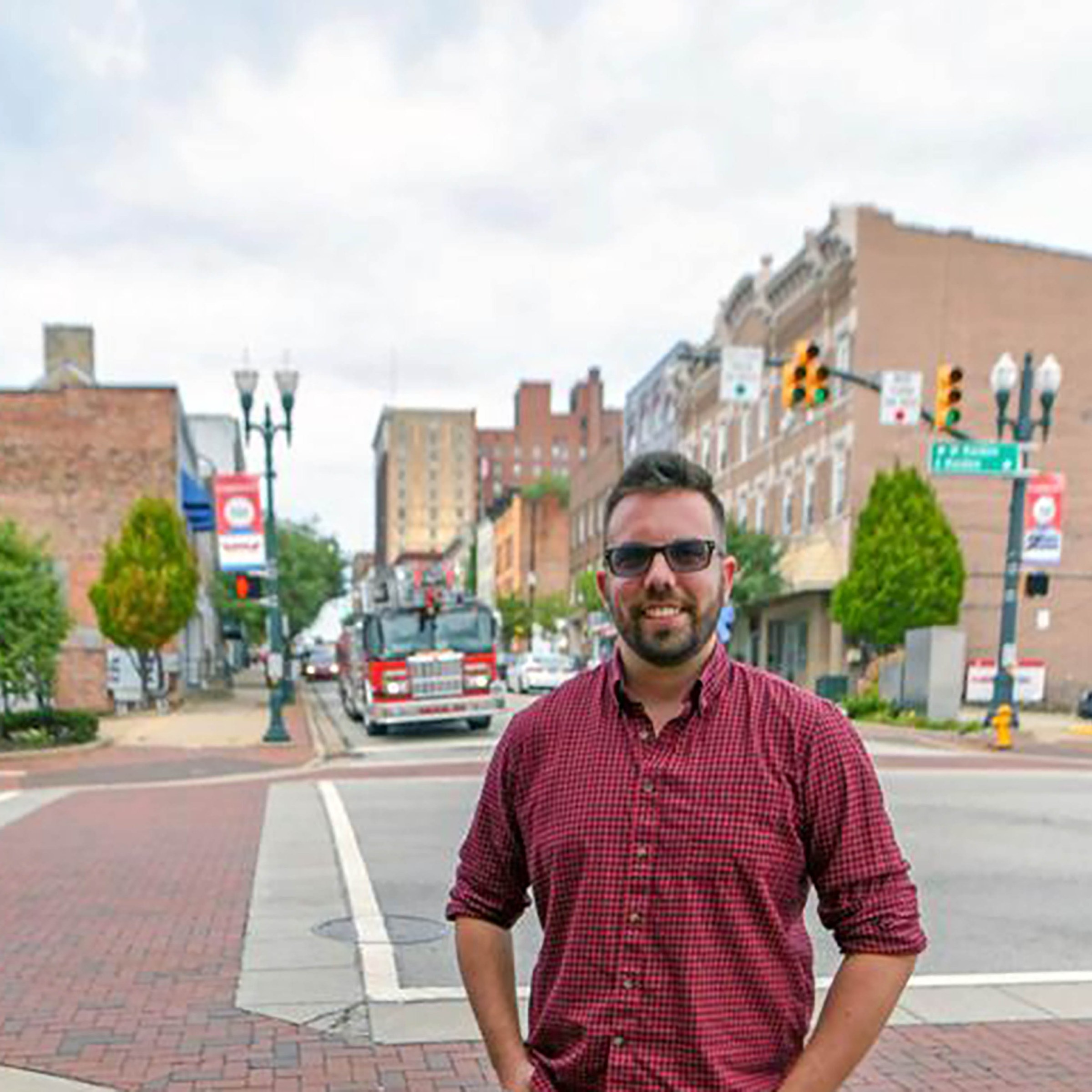 Photo of Will Prince in front of town intersection 