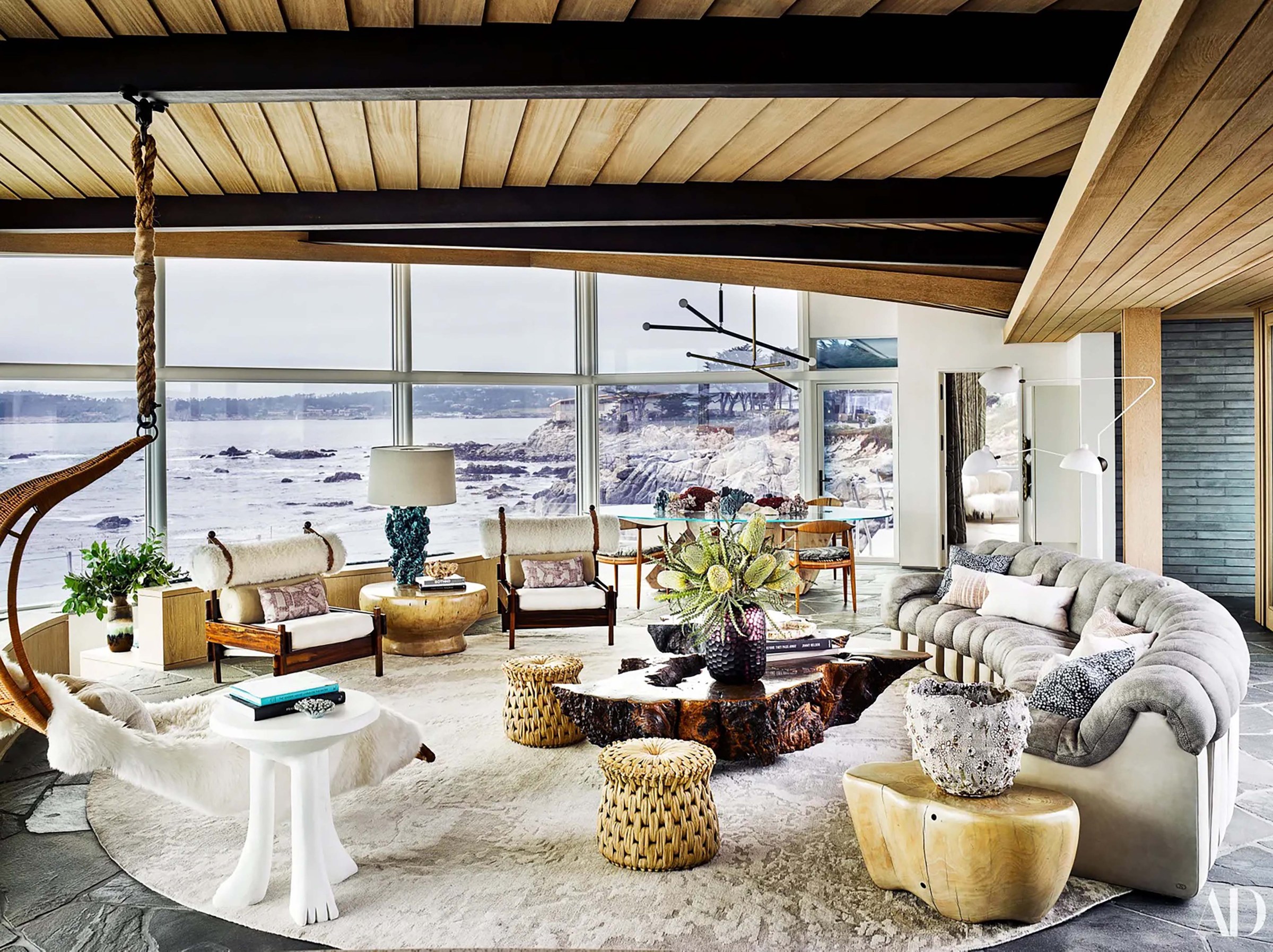 Modern living room with view looking out on the ocean 