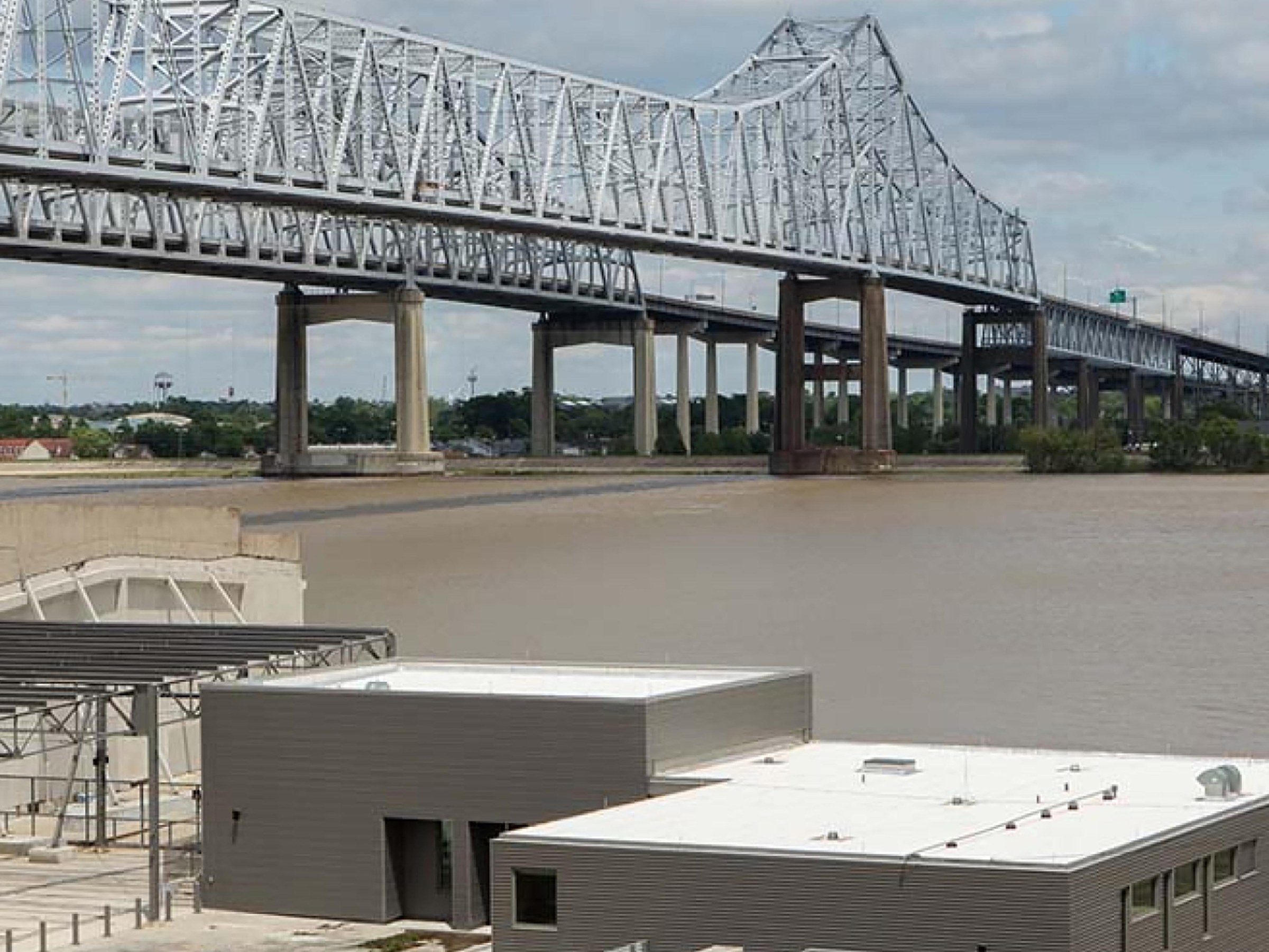 Photo of Tulane River Coastal Center and bridge in the background 