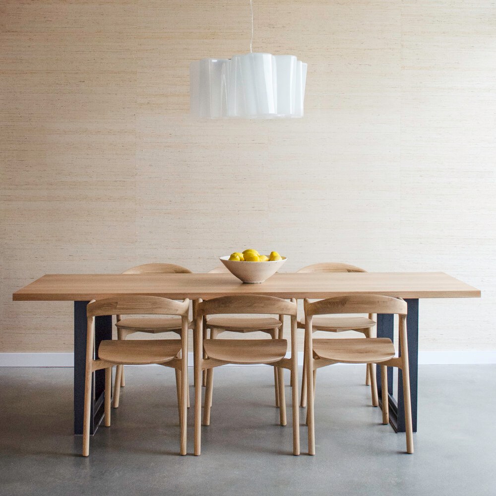 picture of wooden dining table with 5 wooden seats, white lamp 