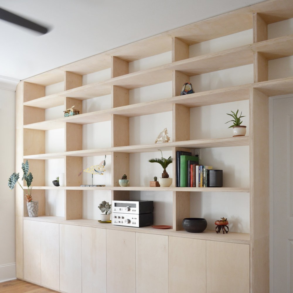 picture of large smooth book shelf with little decorations on it